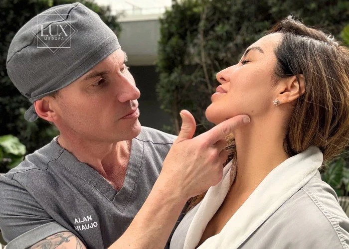 Alan Araujo, founder of Lux MedSpa Brickell, showing the jawline contour of a real client after facial treatment in Miami