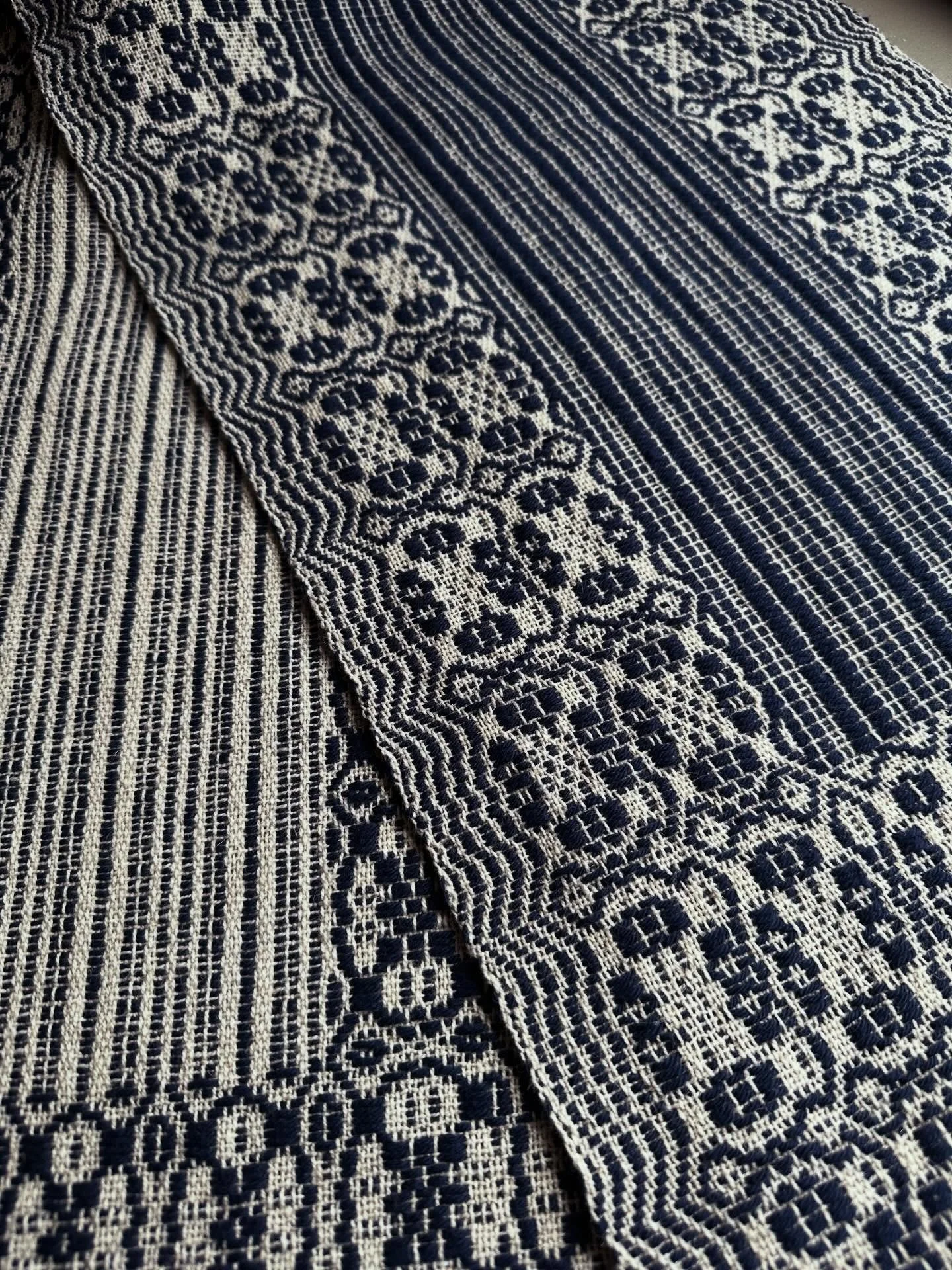 Tablerunner front and back. Three of these  elegant overshot runners &mdash; marine blue, cherry red and taupe &mdash; are now added to the ever growing pile of woven textiles for  @bhamfarmersmkt. Though I don&rsquo;t return to the market until mid 