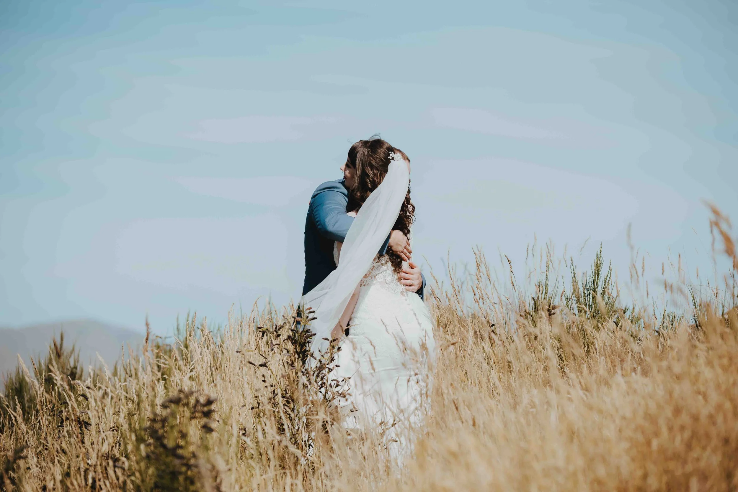 bride and groom hugging bride and groom hugging