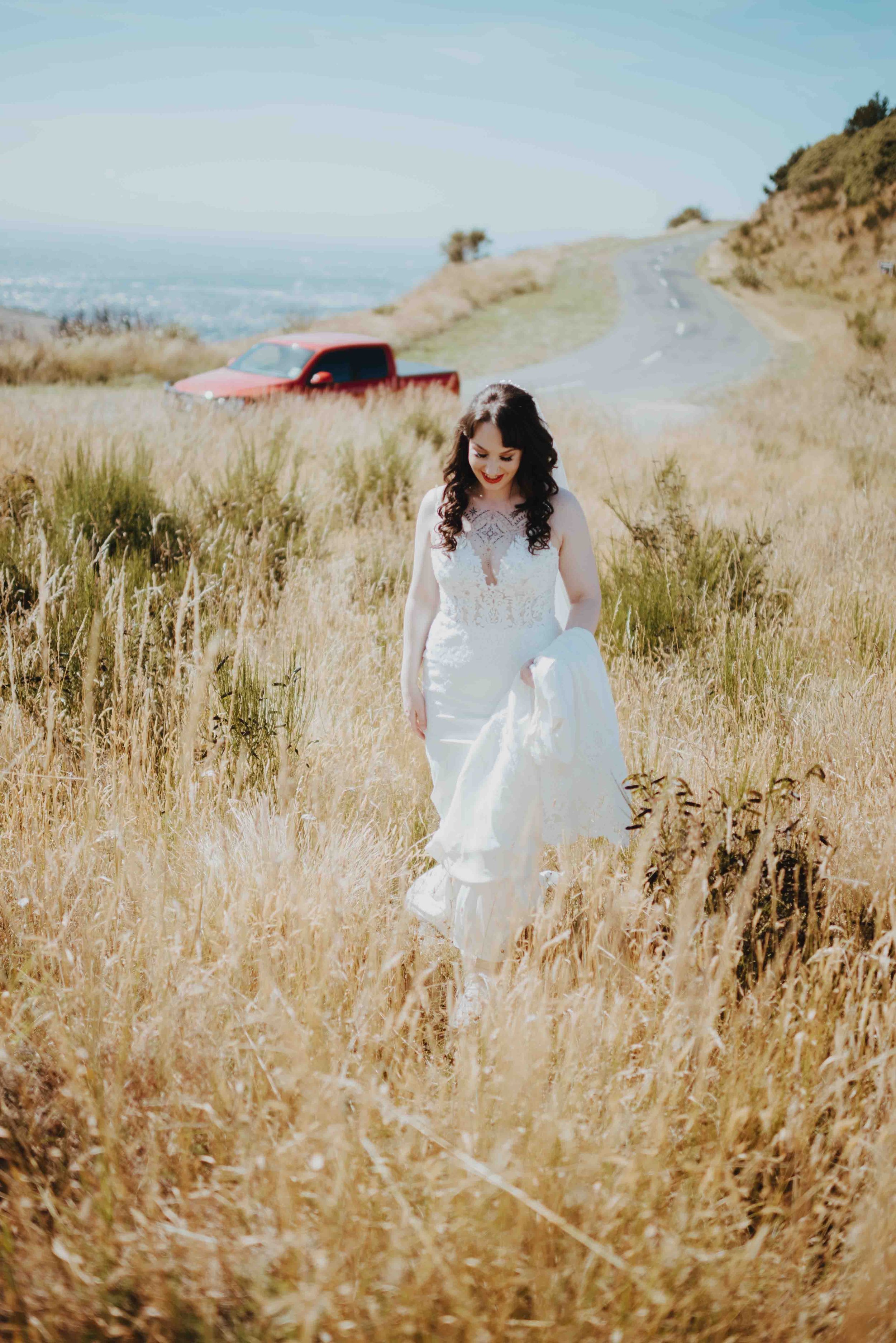 bride walking up the hill to her groom bride walking up the hill to her groom