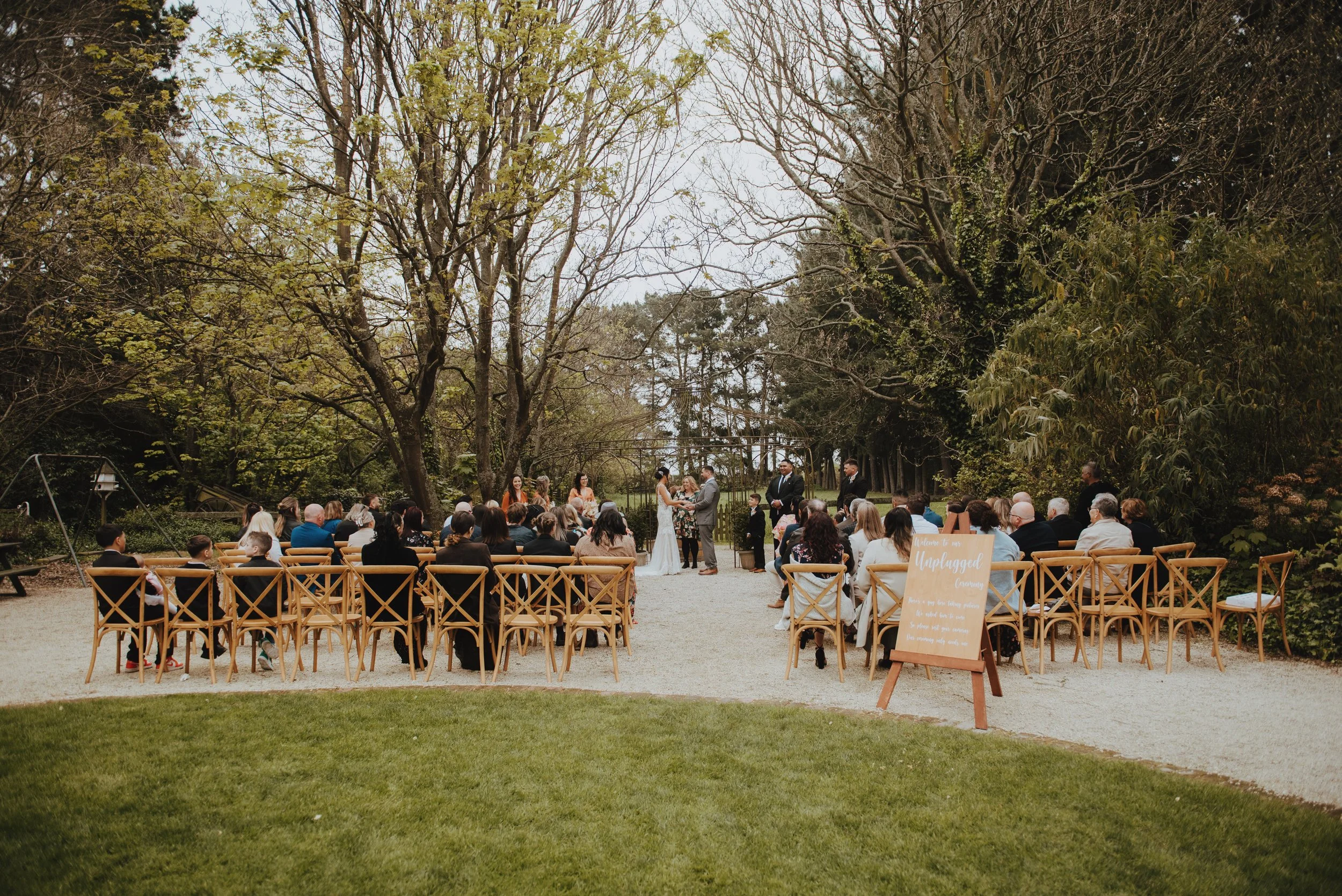 wedding ceremony held at garden wedding venue trents vineyard