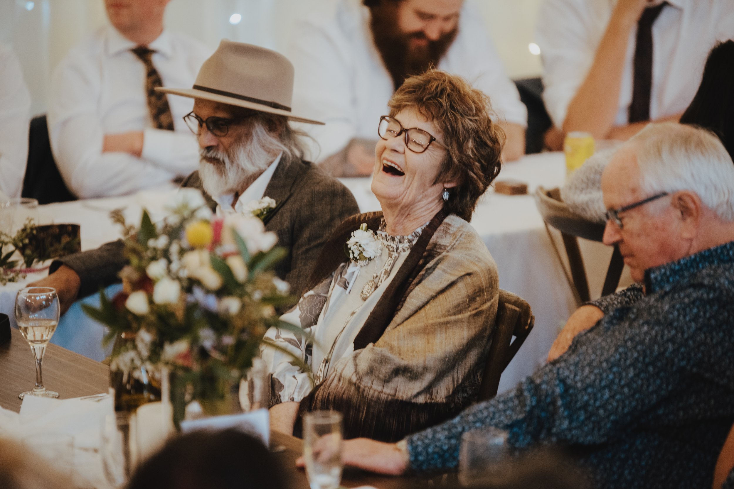 mother of the bride laughing at a joke