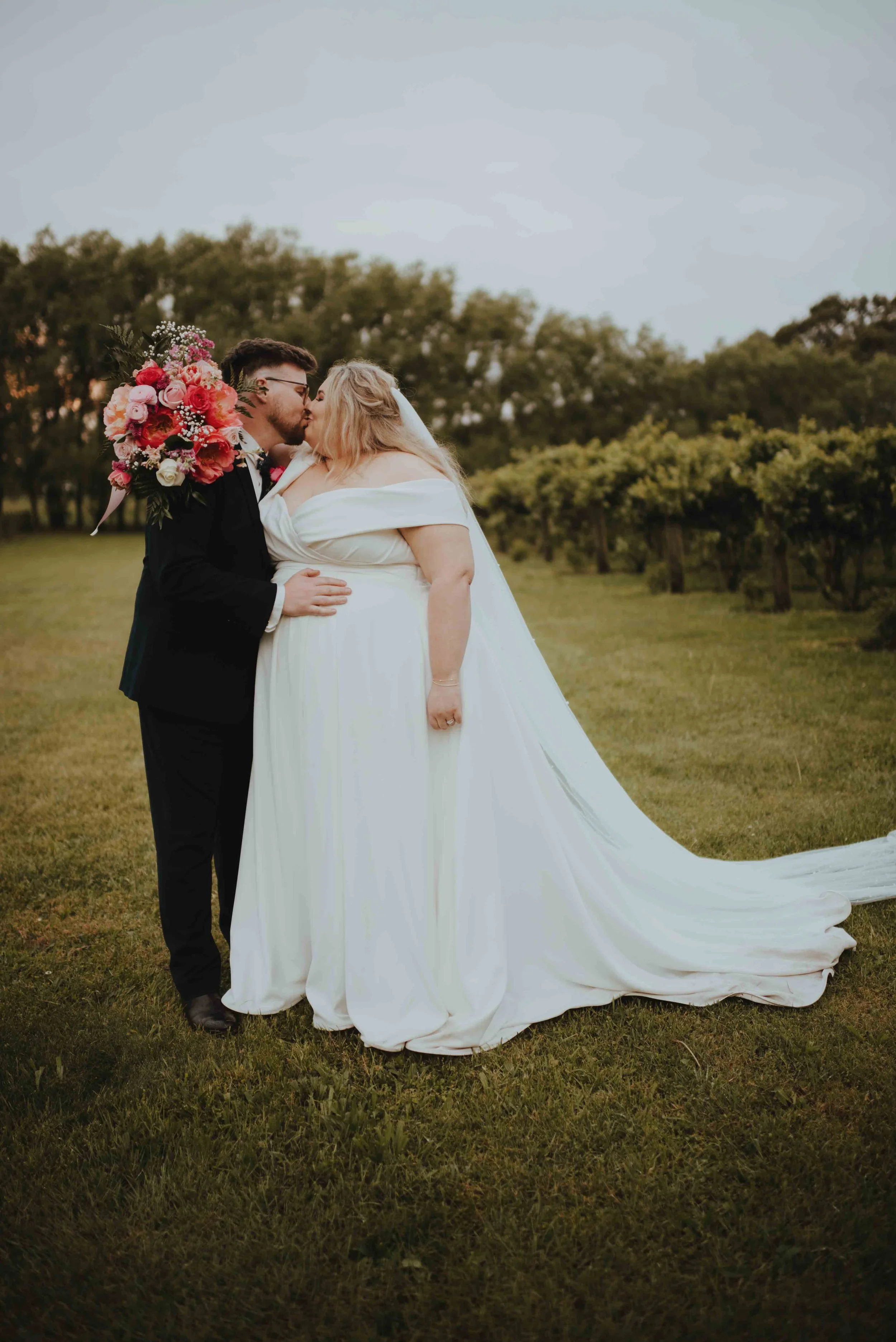 newlyweds stealing kisses at sunset newlyweds stealing kisses at sunset