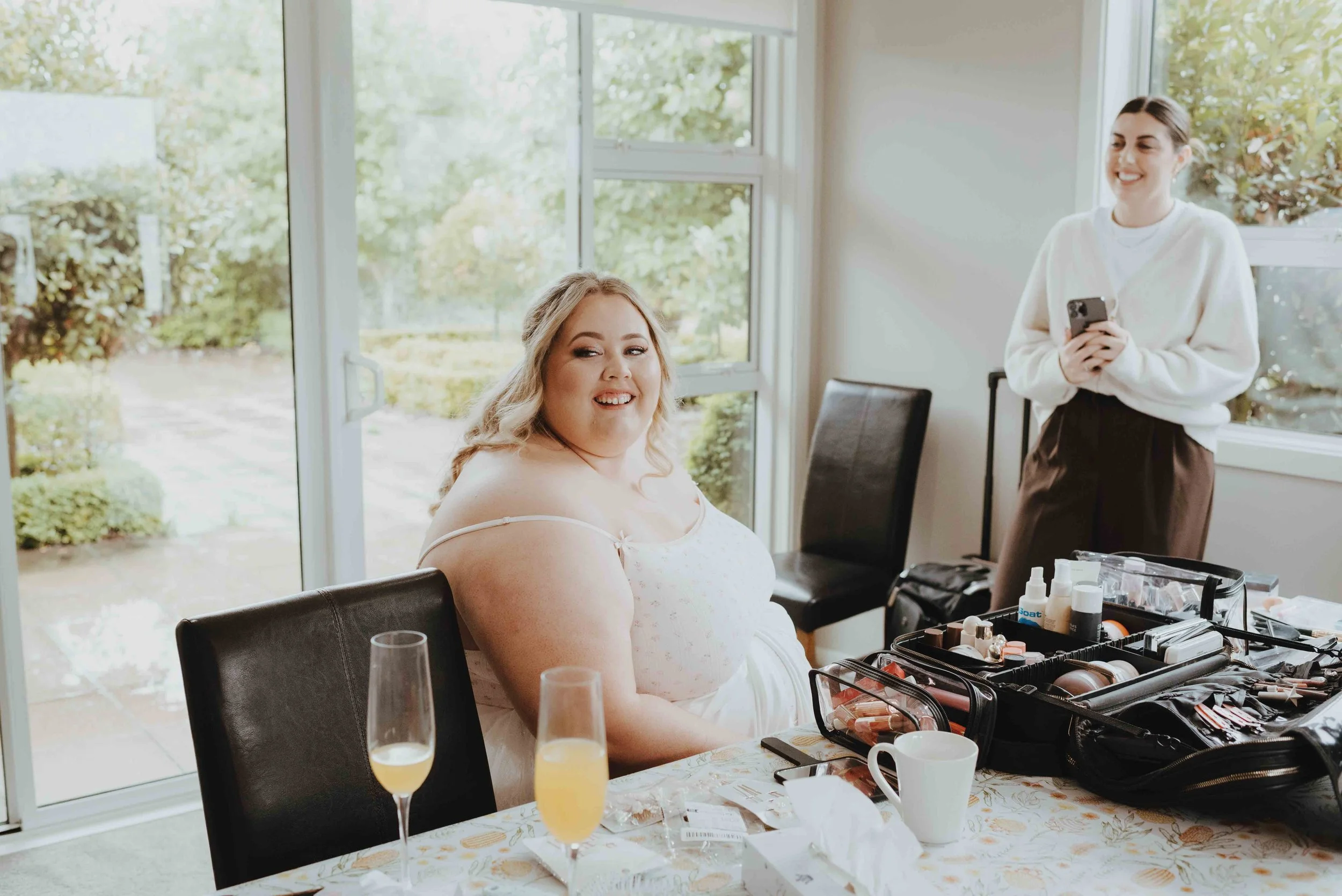 bride looking back at her father from the makeup chair bride looking back at her father from the makeup chair