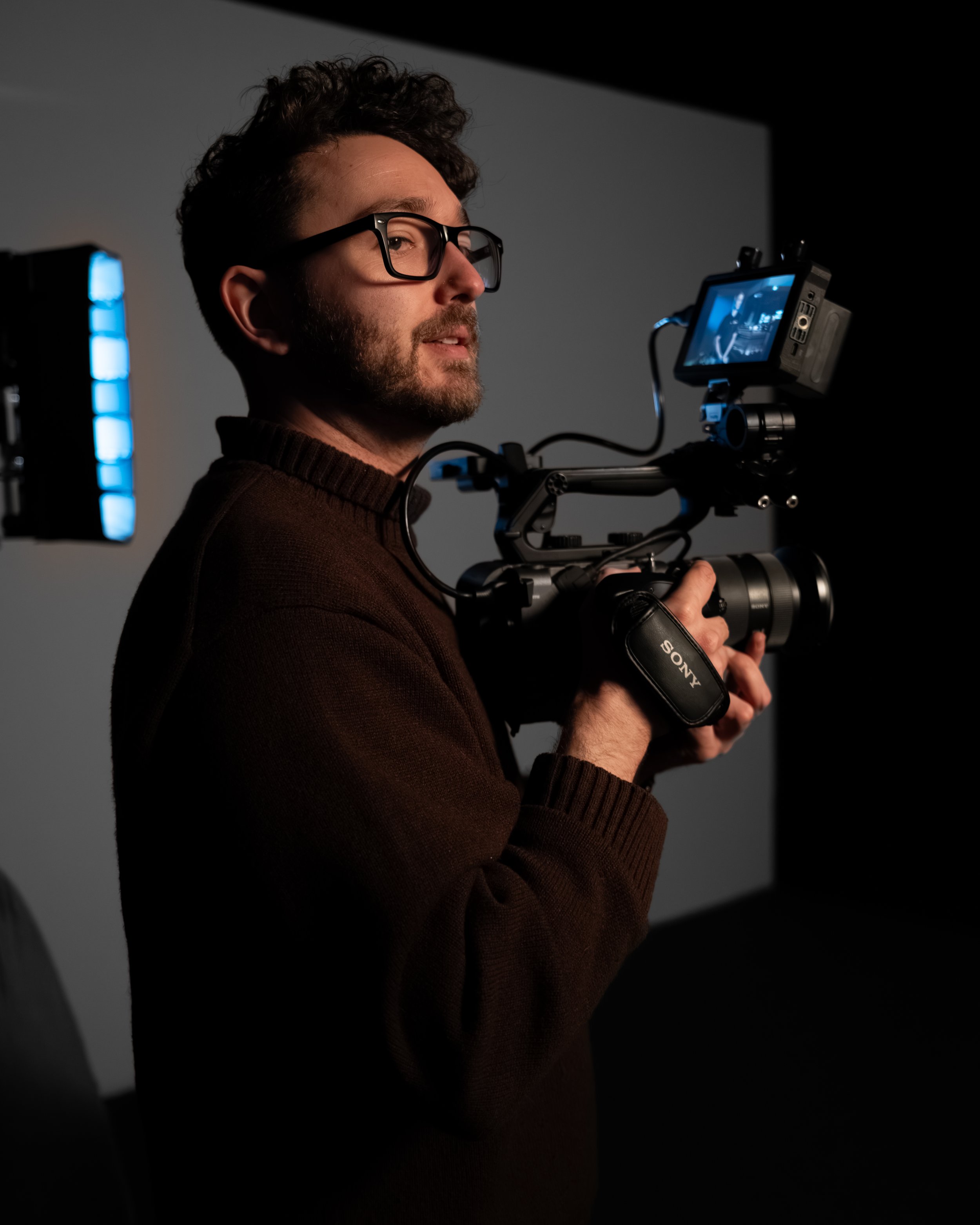 DP René Arseneau holds a camera during the filming of the GoPlex x Demidov commercial