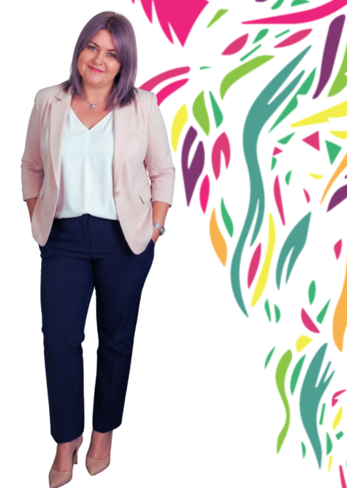 A woman standing with her hands in her pockets, wearing a beige blazer, white blouse, navy pants, and beige heels, with a colorful abstract floral background.