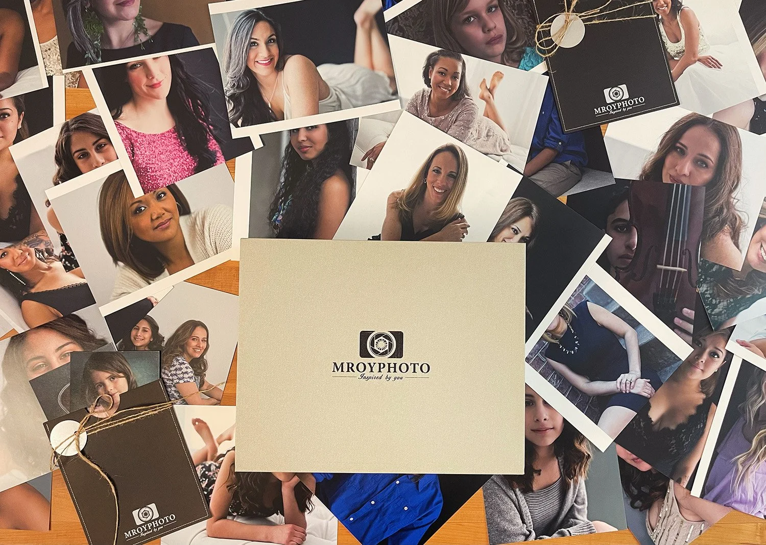 Light gray MroyPhoto branded photo box surrounded by a collage of photos of women and family photos taken by Northern Virginia base Photographer Myrtle Roy.