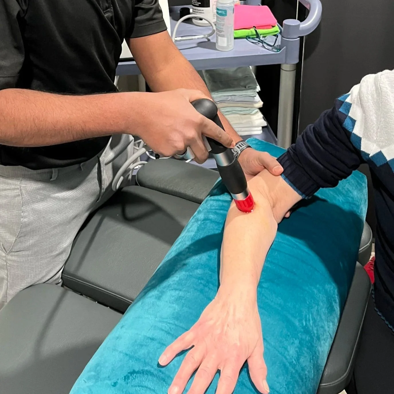 Deepesh providing a shock wave therapy treatment.