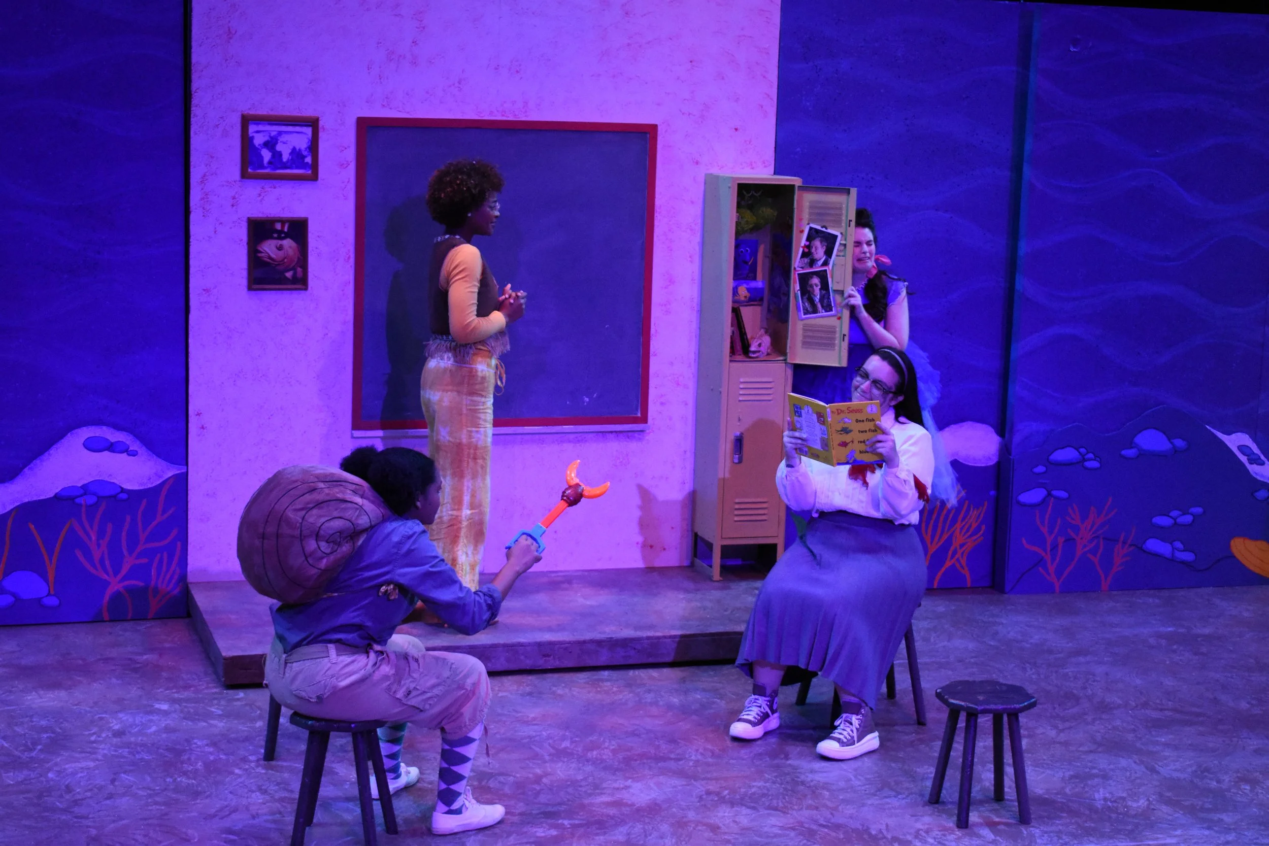 Actors performing a scene from Dr. Seuss's 'The Sneetches' with colorful set design, props, and costumes.