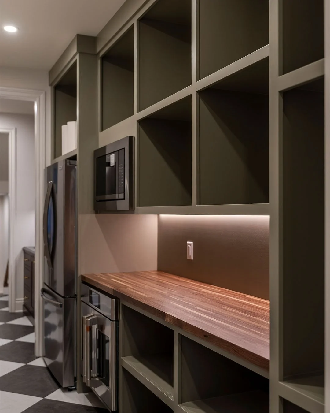 One home. Multiple experiences. 

A #custombuild is not just about square footage. It&rsquo;s about intentional spaces that serve different purposes. 

A hallway behind the #kitchen keeps extra cabinetry and appliances out of sight, protecting a clea