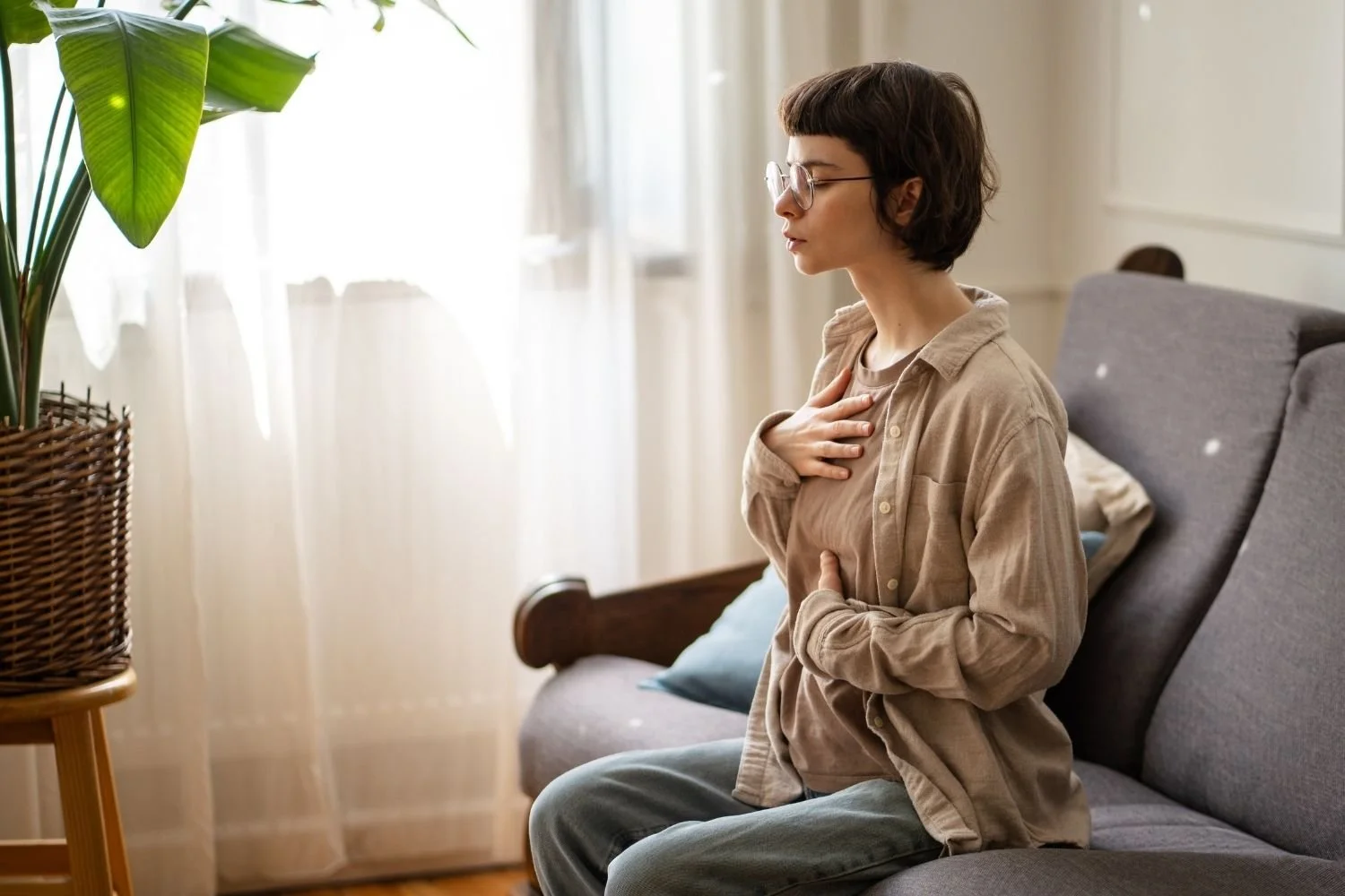 Young woman regulating her trauma response at home