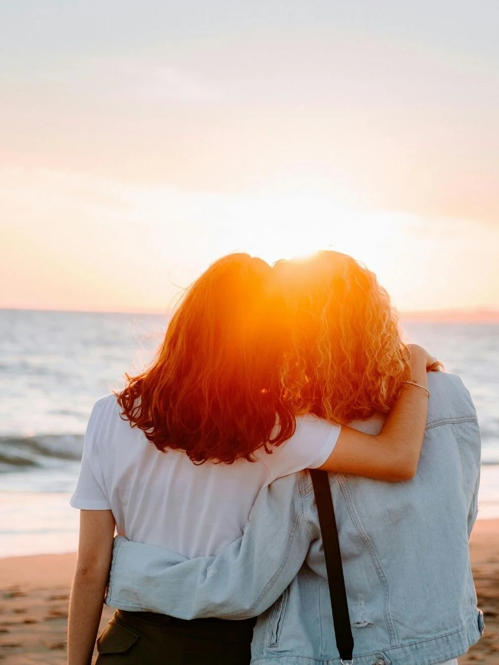 Two bestfriends looking at a sunset together