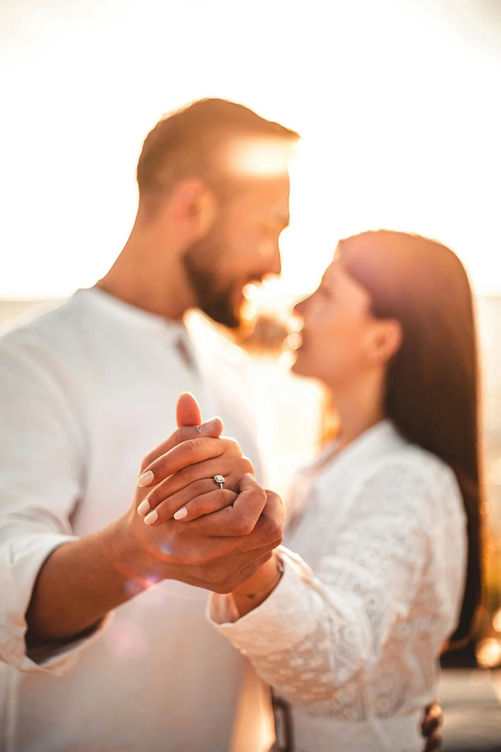 Newly engaged couple in the sunset