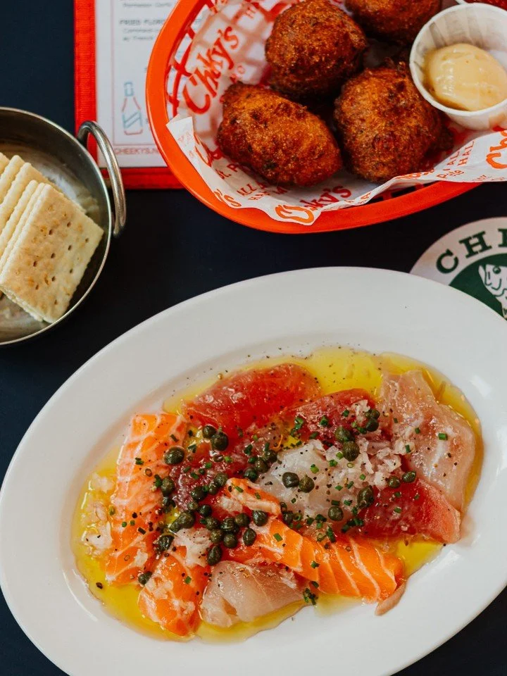 Swipe for the best bite.

Sicilian Crudo with salmon, snapper &amp; tuna and with shallots, capers, olive oil, citrus and black pepper.