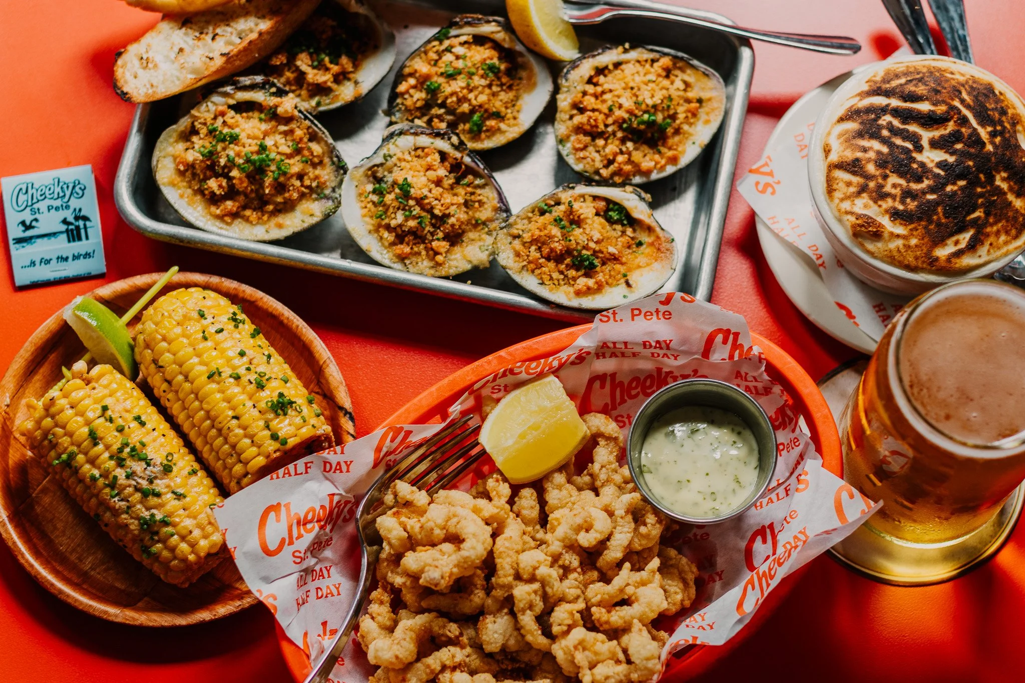 Summer spread: Montauk-style fried clam basket, grilled corn, baked clams, s'mores and an ice cold Cheeky Pint