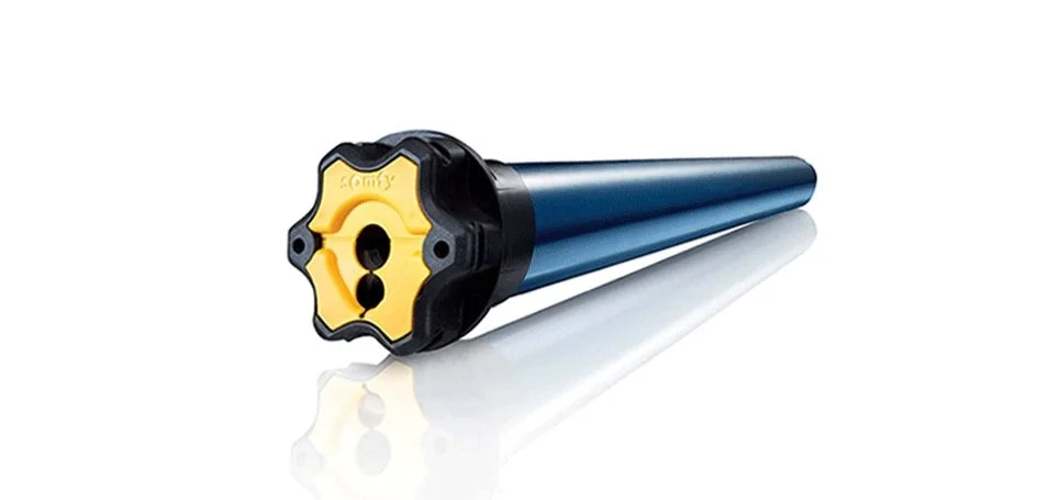 Electric tubular motor for blinds and shades with yellow and black gear end cap.