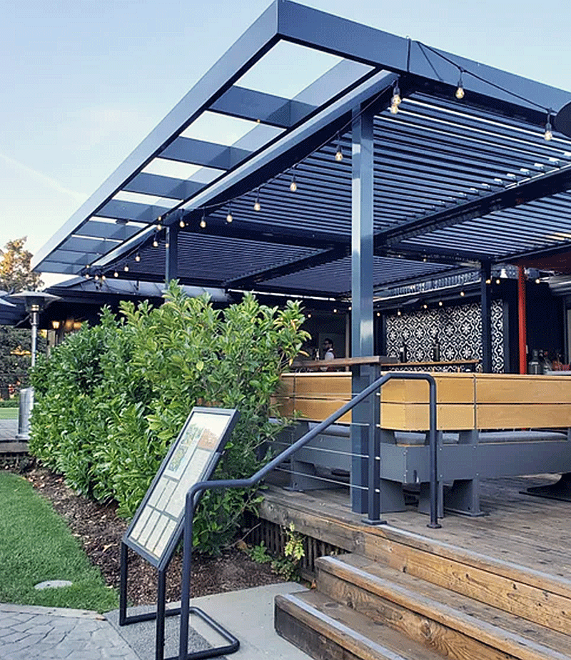 Louvretec 180 Linear louvered roof with aluminium frame over an outdoor dining deck, installed by Exterior Perfections.
