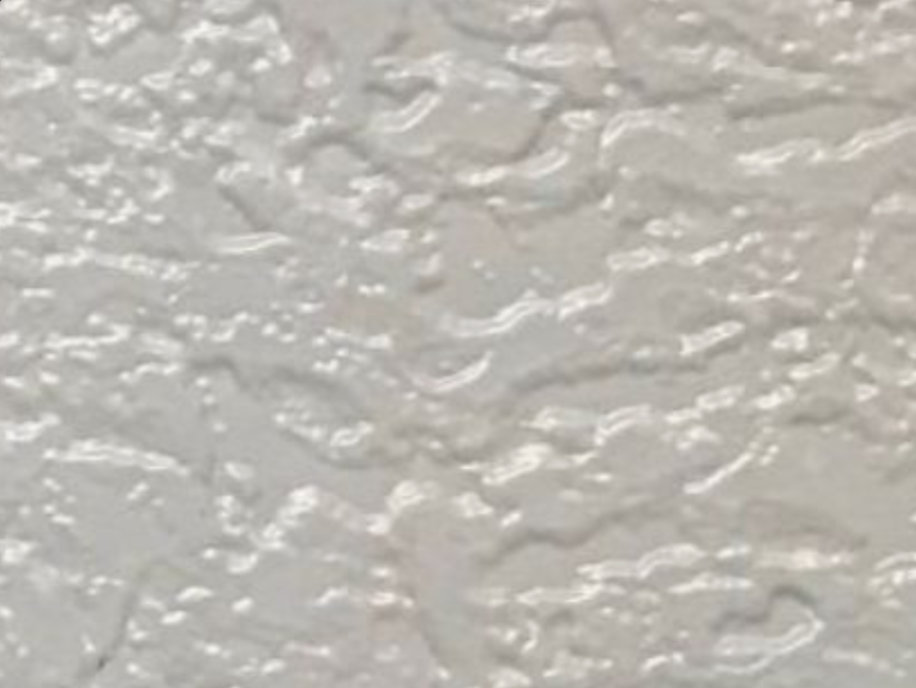 close-up of textured white wall with a stucco finish