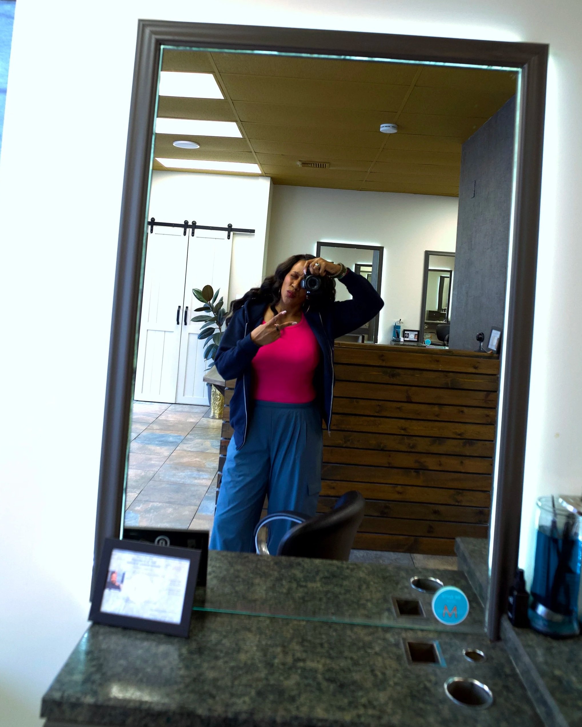 Elsi Pacheco capturing content at Willows Cove Salon in Mineola during the brand content day for the website redesign project with Link Up Level Up