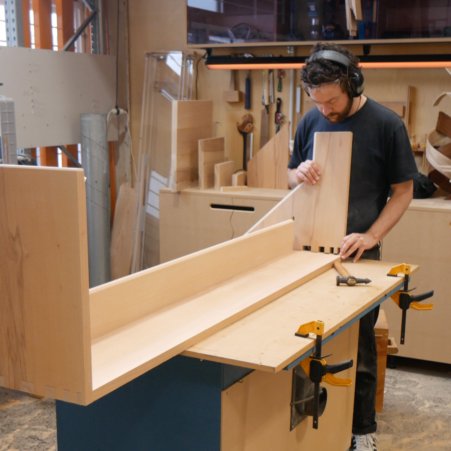 Craftsperson in Workshop assembling Bench