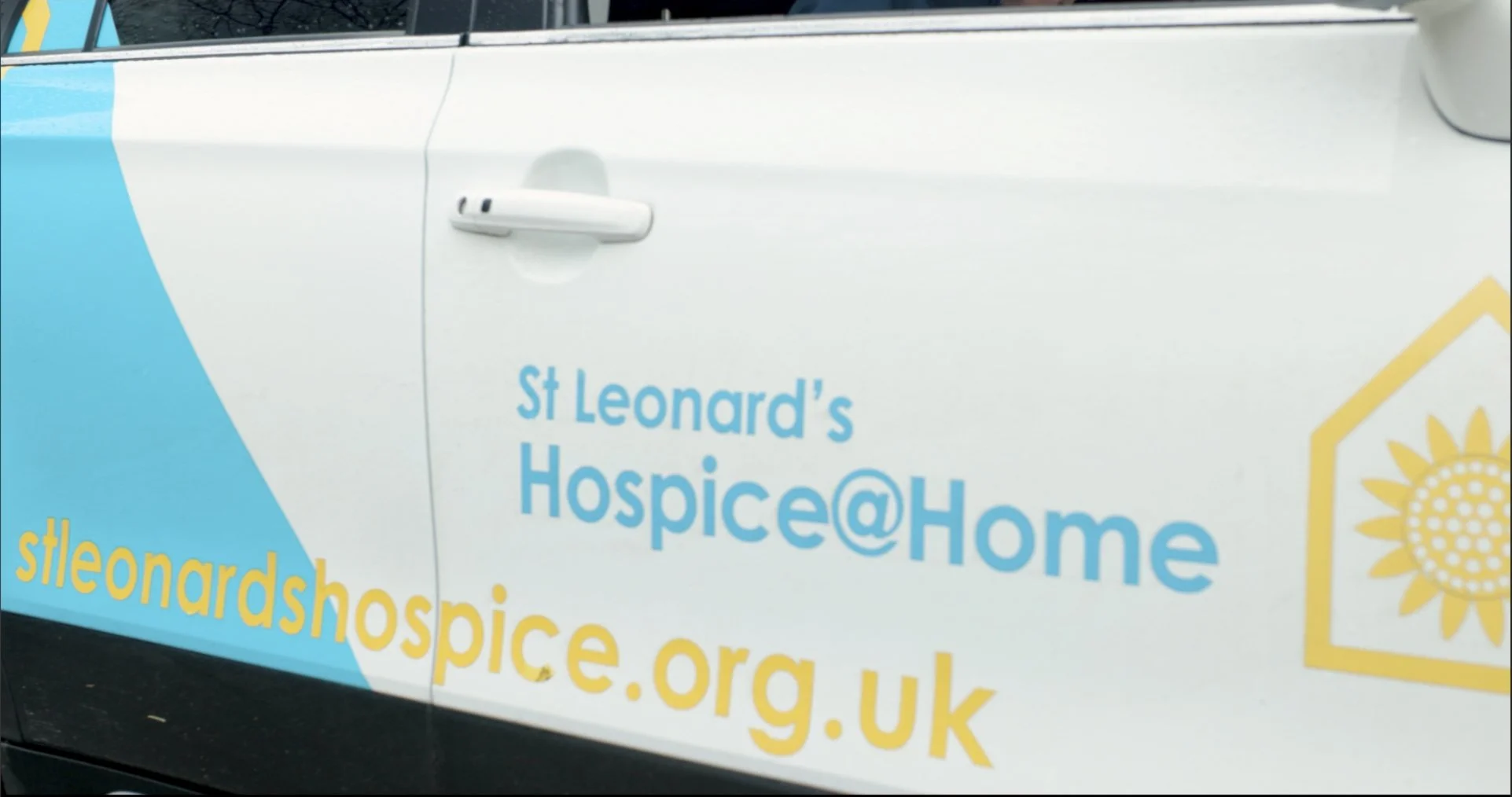 image of a car door with St Leonards hospice logo on. 