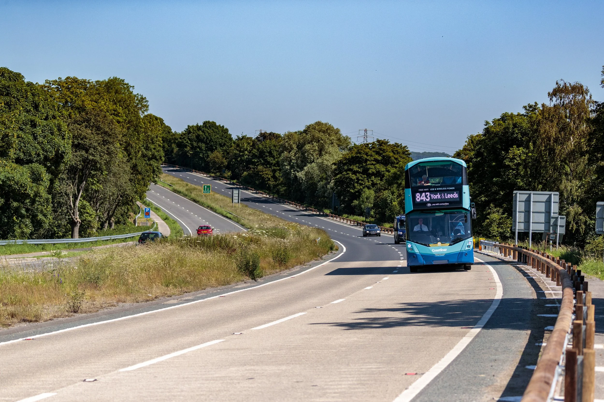 A bus driving down the A64 on the dual carriage way