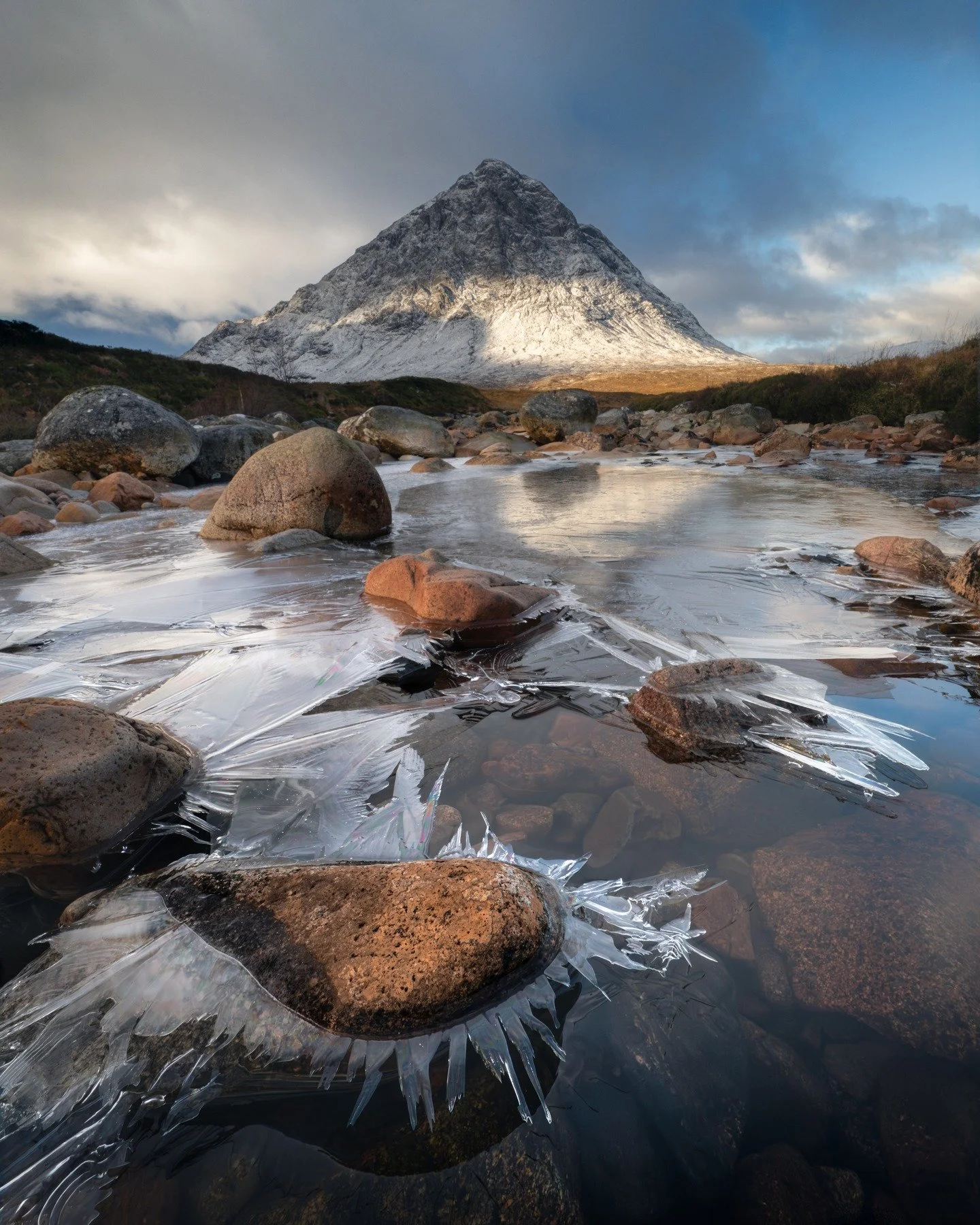 Morning at Etive Mor 
A bit of frost, soft autumn hitting the mountain just right. I loved searching for compositions in the frozen river. Once I started, I could hardly stop myself.

#EtiveMor #Glencoe #ScotlandLandscapes #MorningLight #AutumnVibes 