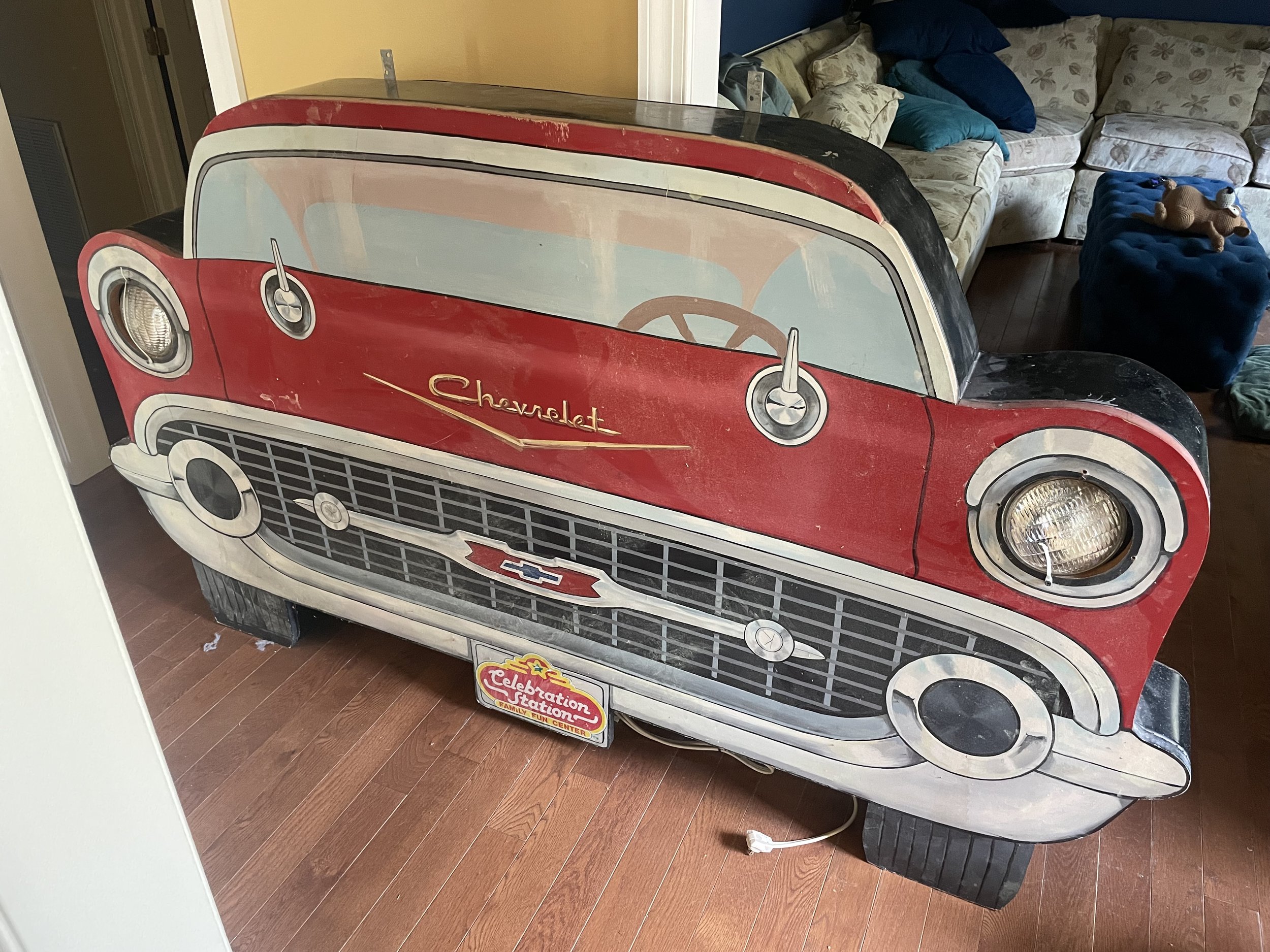 The original sign, prior to being embellished with neon elements. The headlights were held in place with zip ties, and were no longer functional.
