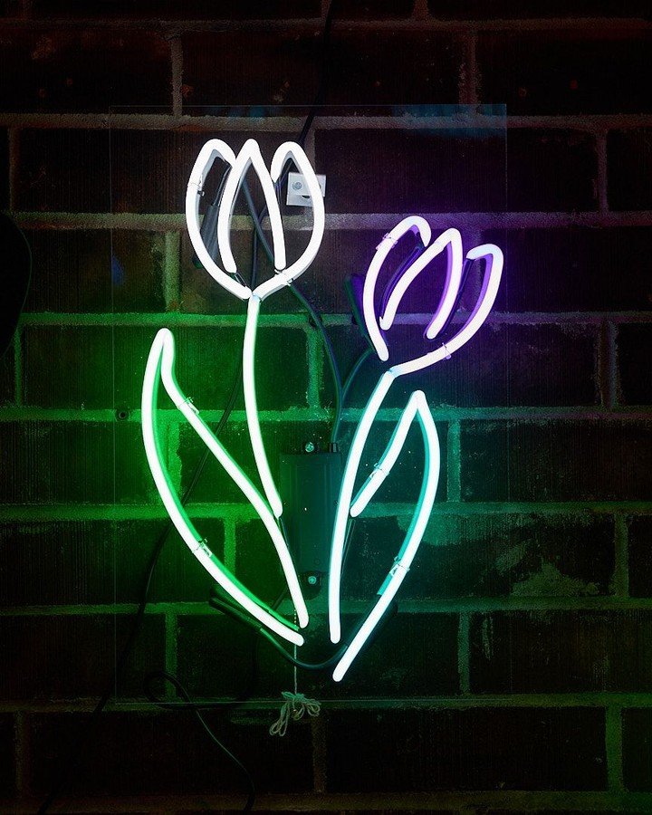 A neon flower created during a workshop.