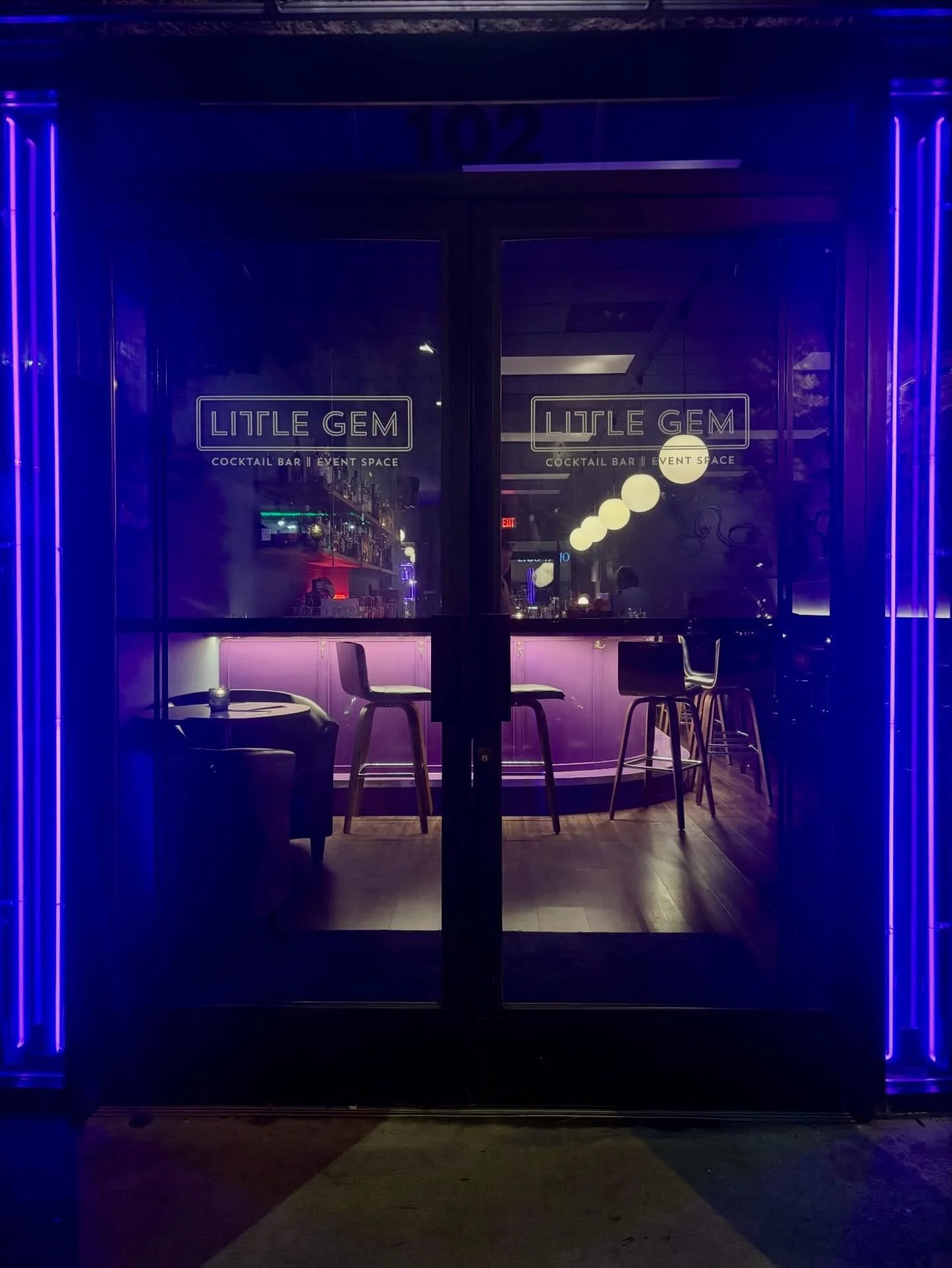 After we'd created their logo sign, Little Gem came back to us to have us add matching neon purple accents to their other entrance. The door is flanked with 15mm and 12mm Bromo Purple tubes, protected inside with clear acrylic panels to keep curious 