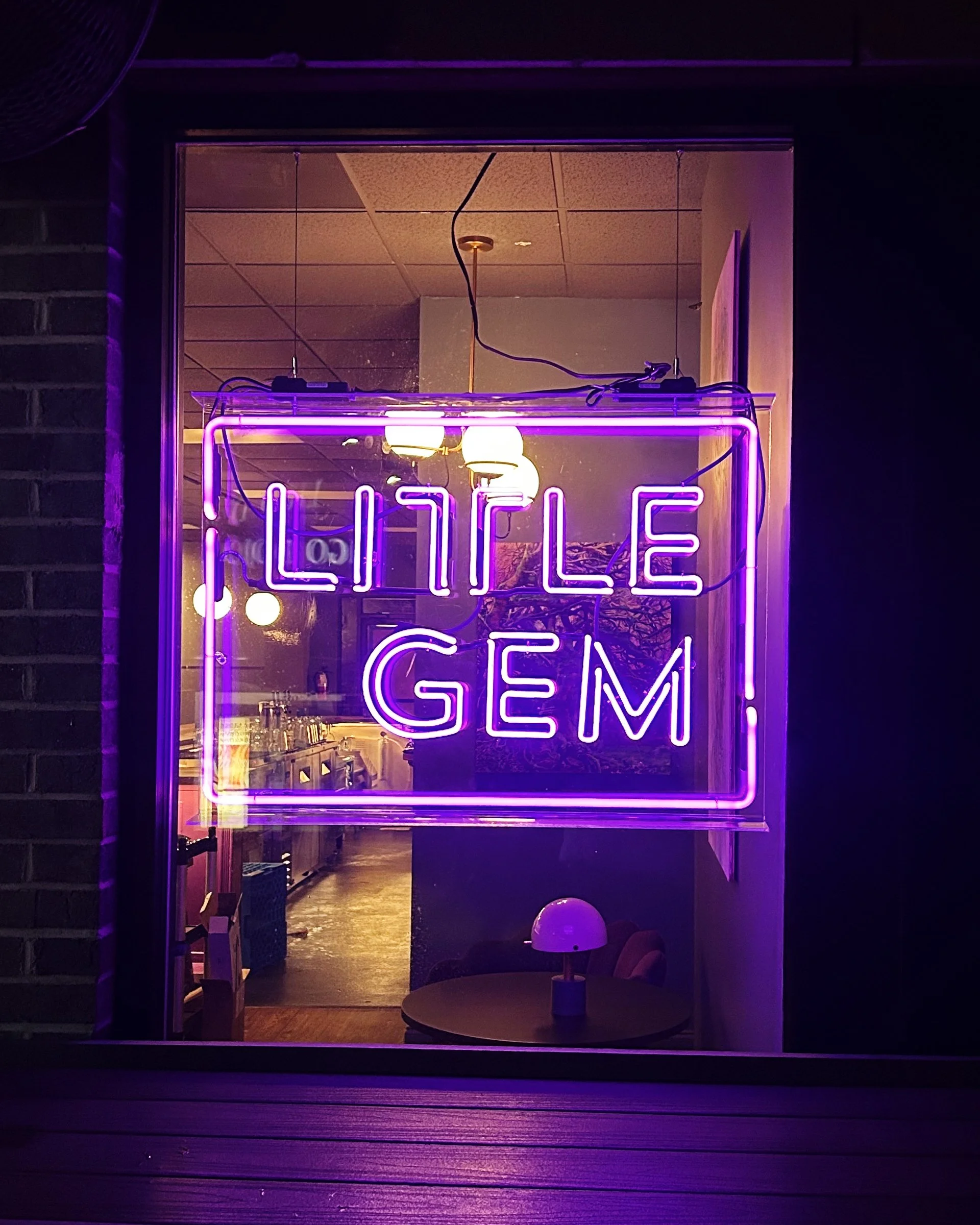 Made with Bromo Purple tubing in 10 and 15mm diameter, Little Gem's window sign provides a welcoming purple glow consistent with their branding.