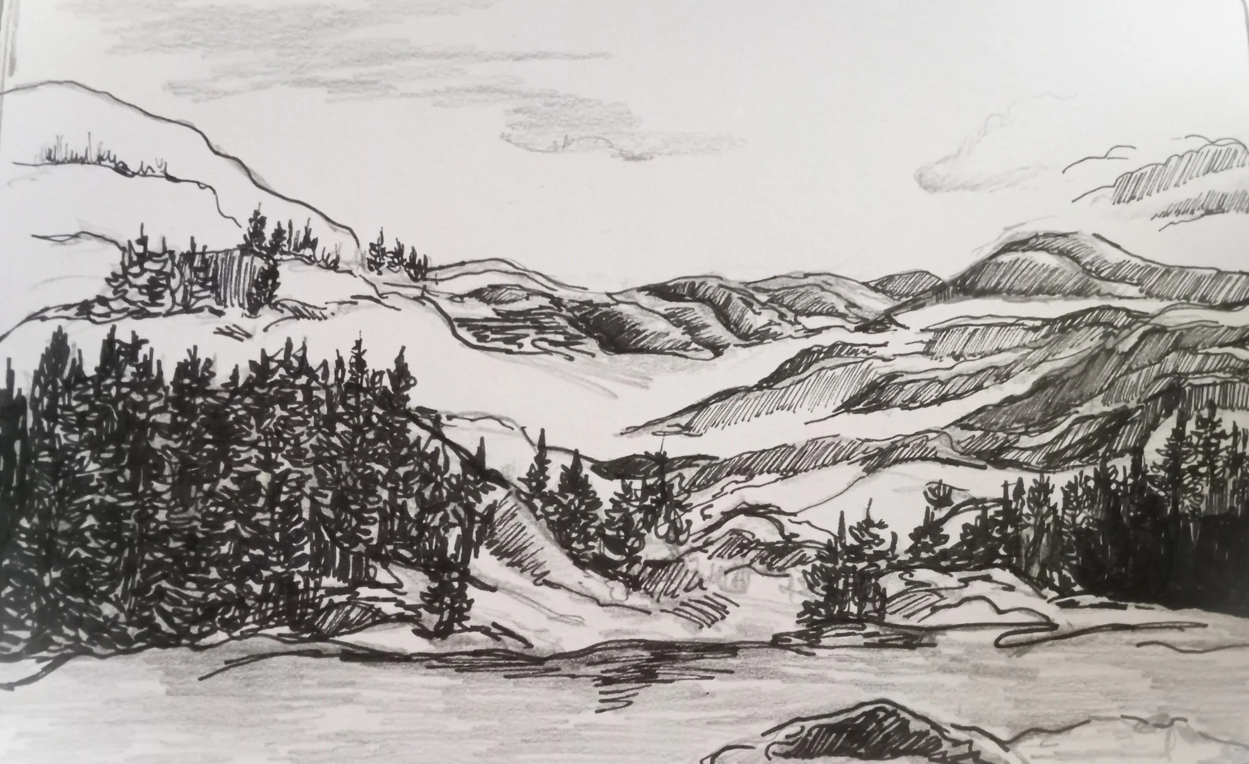 A black and white sketch of a mountainous landscape with trees in the foreground, hills and mountains in the background, and clouds in the sky.