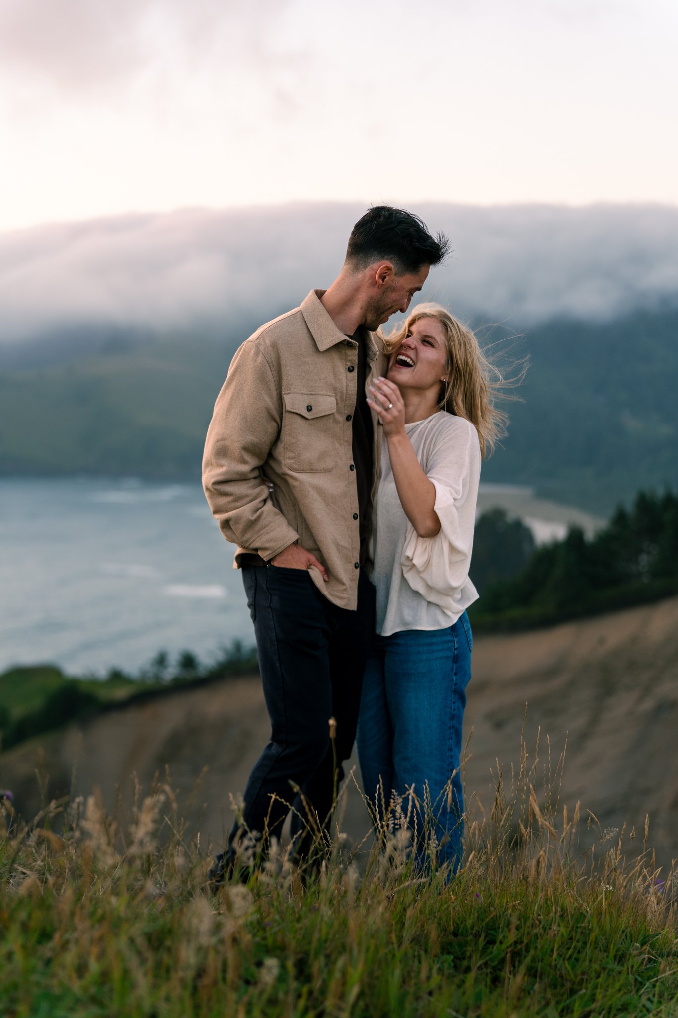 A couple on top of God's Thumb after a lincoln city proposal