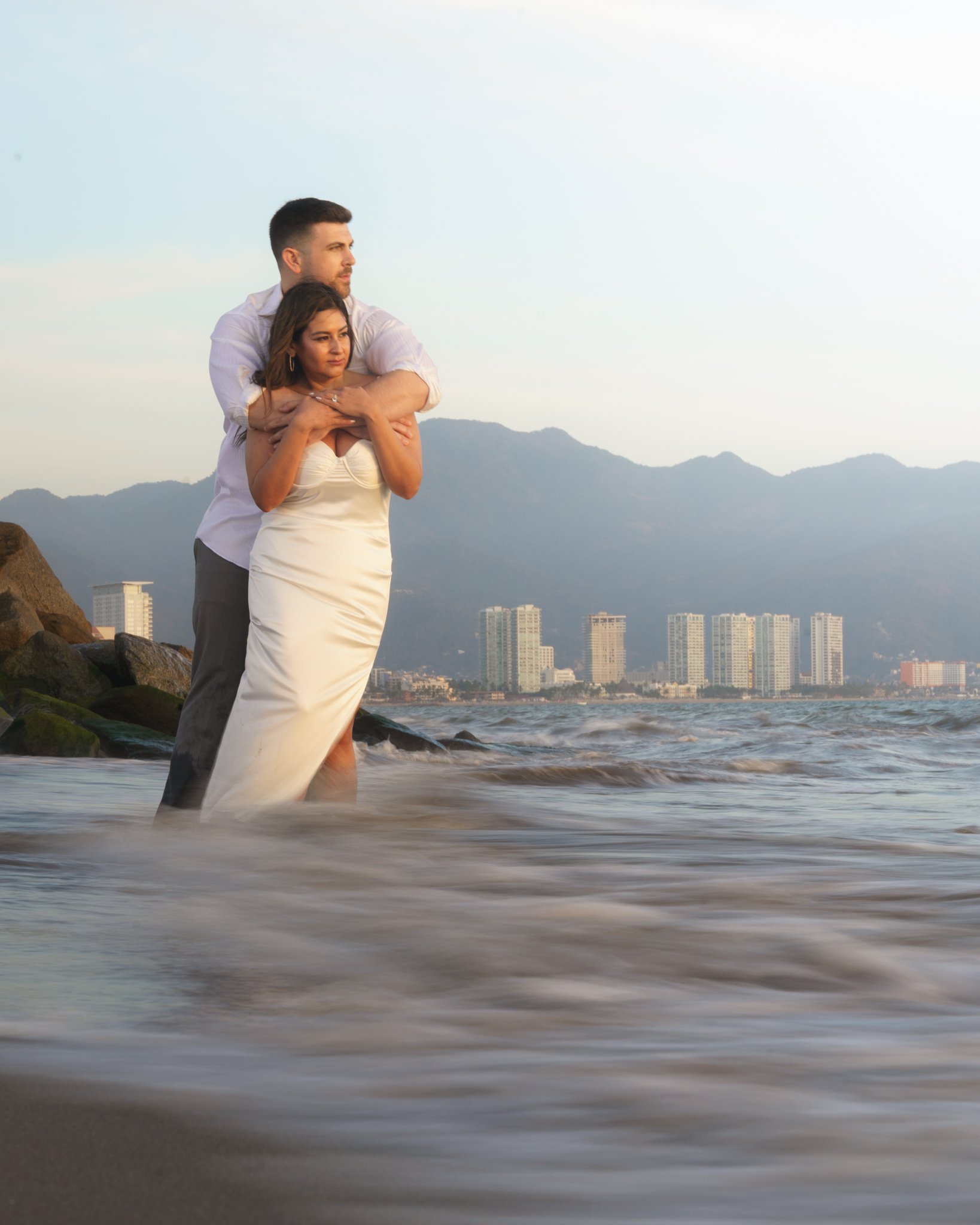 Portrait of a couple running on the beach in Puerto Vallarta, Mexico during an engagement session