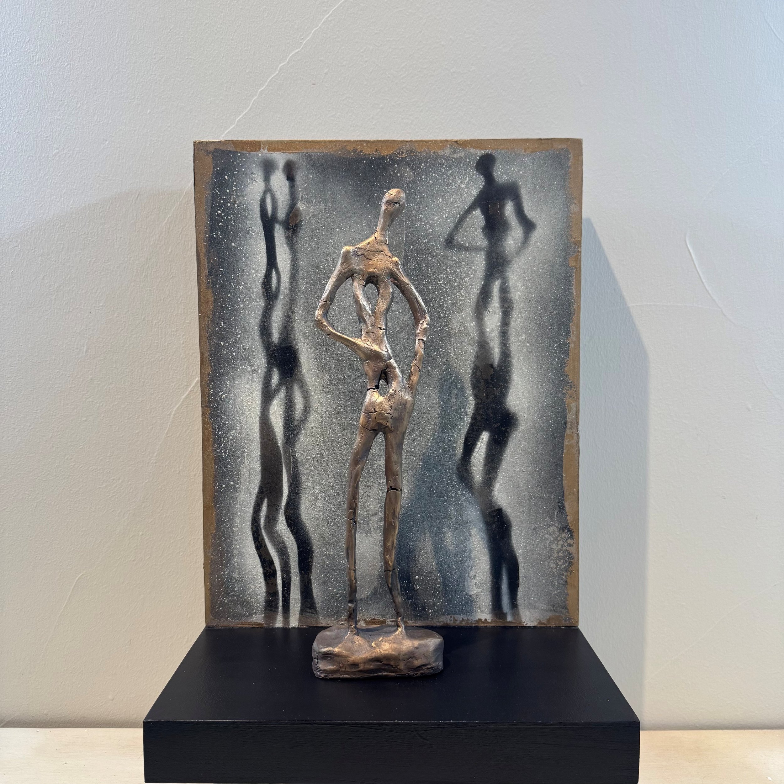 Shadows and Grace No. 1, bronze on wood