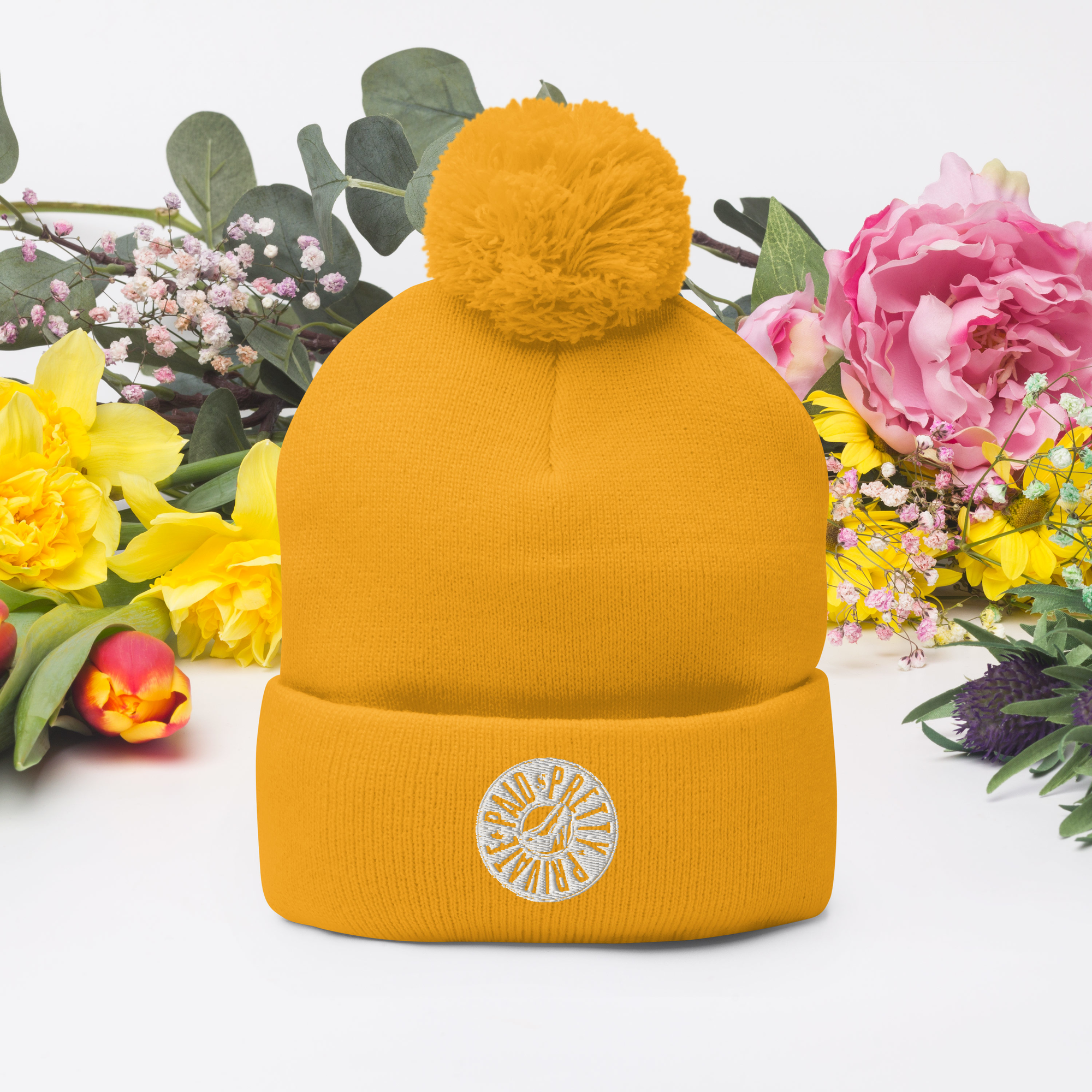 pom-pom-knit-cap-gold-front-677f4b2120b2b.png