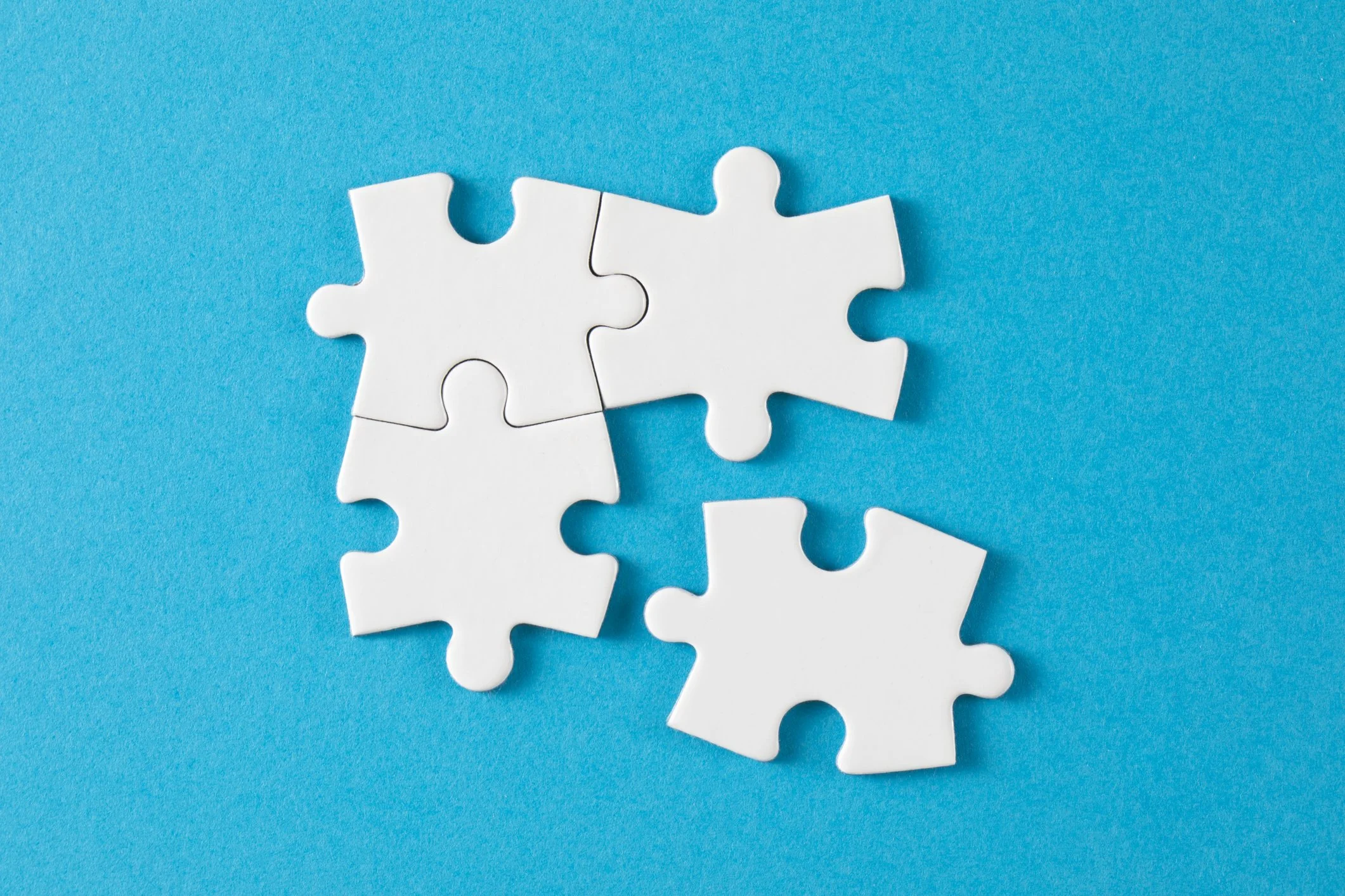 A picture of a jigsaw with one piece disconnected