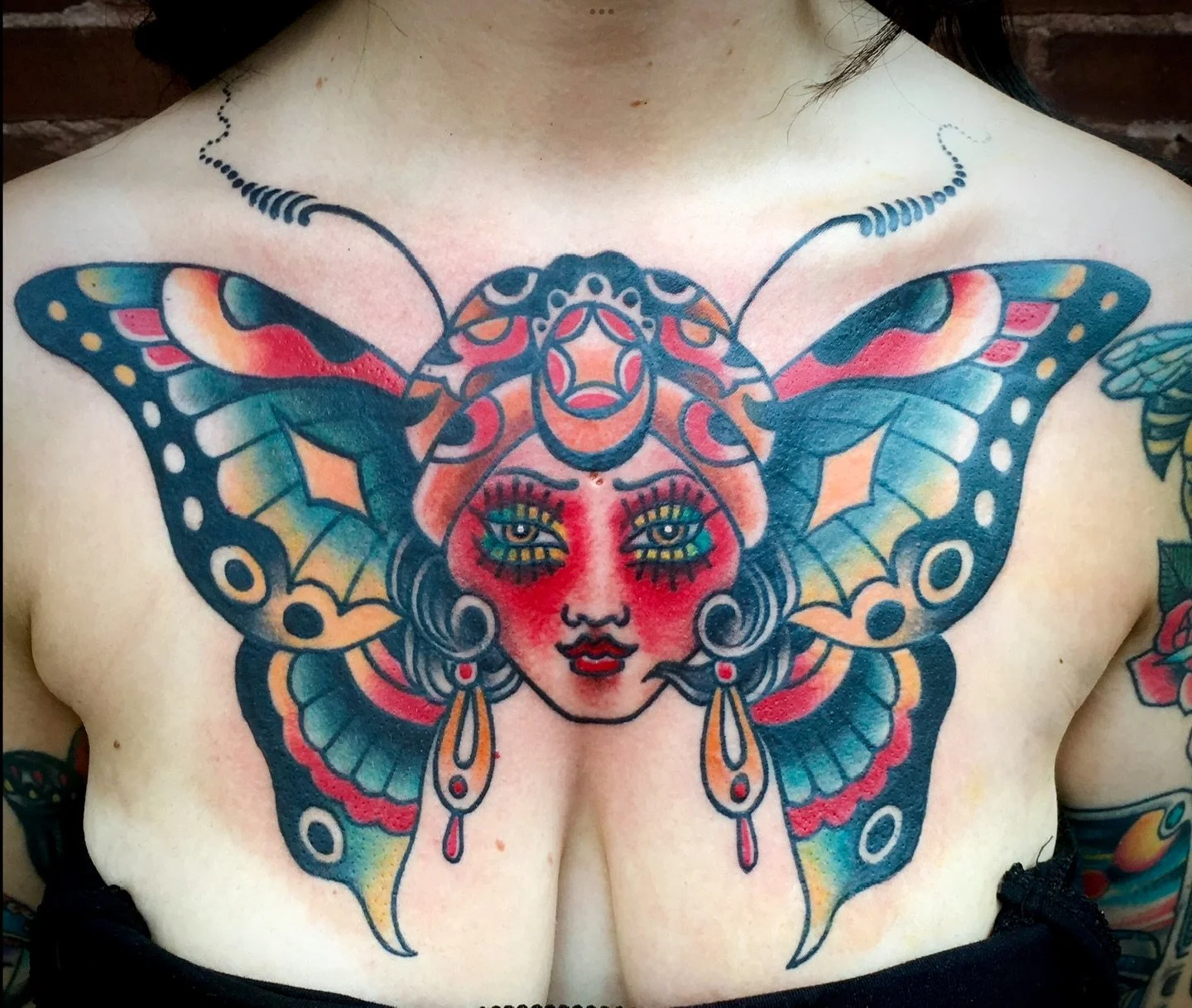 Colorful chest pieces by @natekatstl 🦋

Nate is in the shop by appointment only.