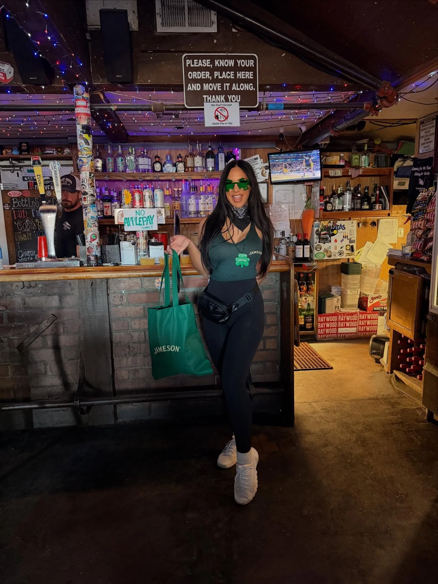 Just a girl standing in front of a bar asking for a Jameson