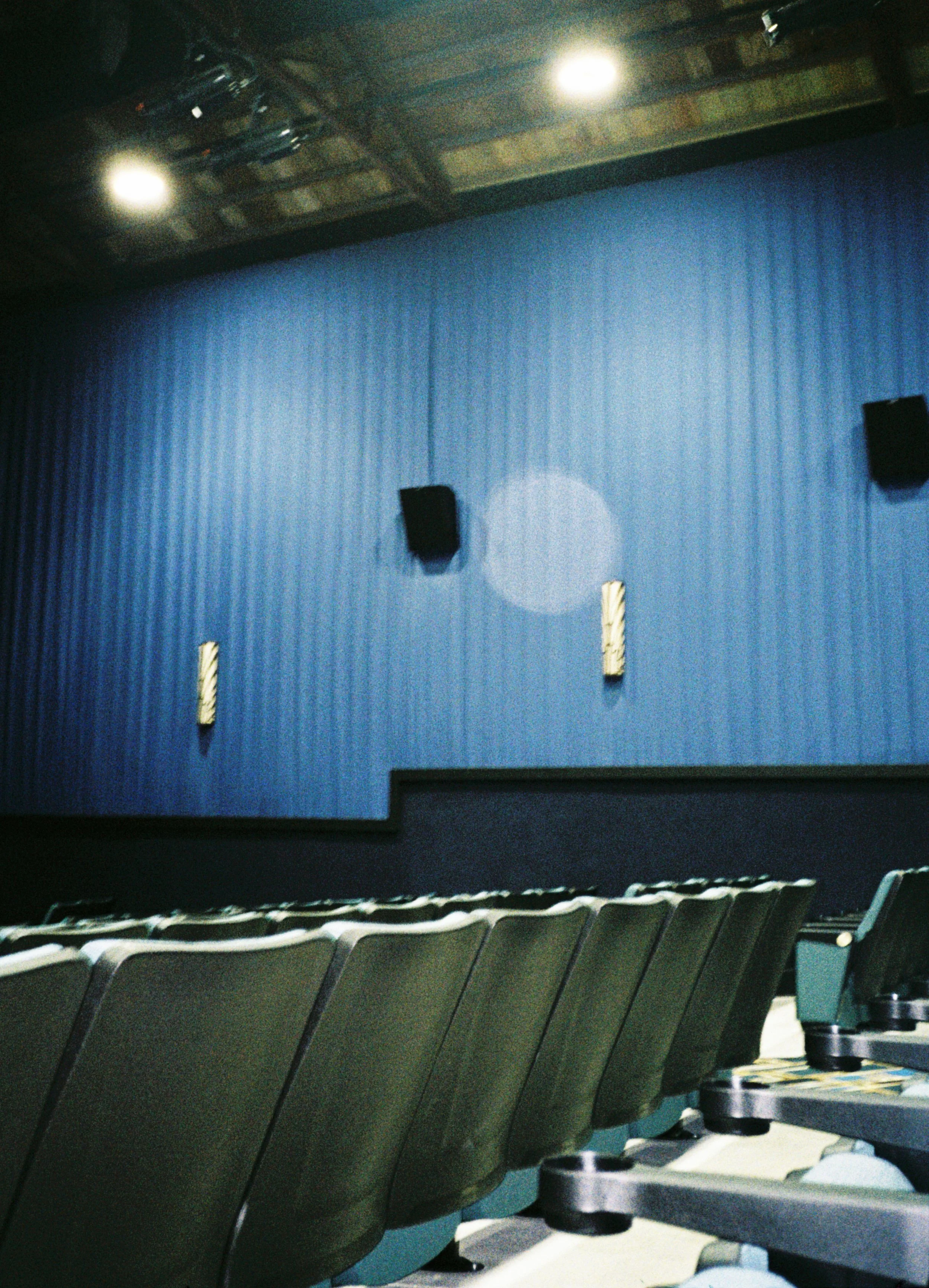 Interior of The Beach Theatre with seating and movie screen in St. Pete Beach