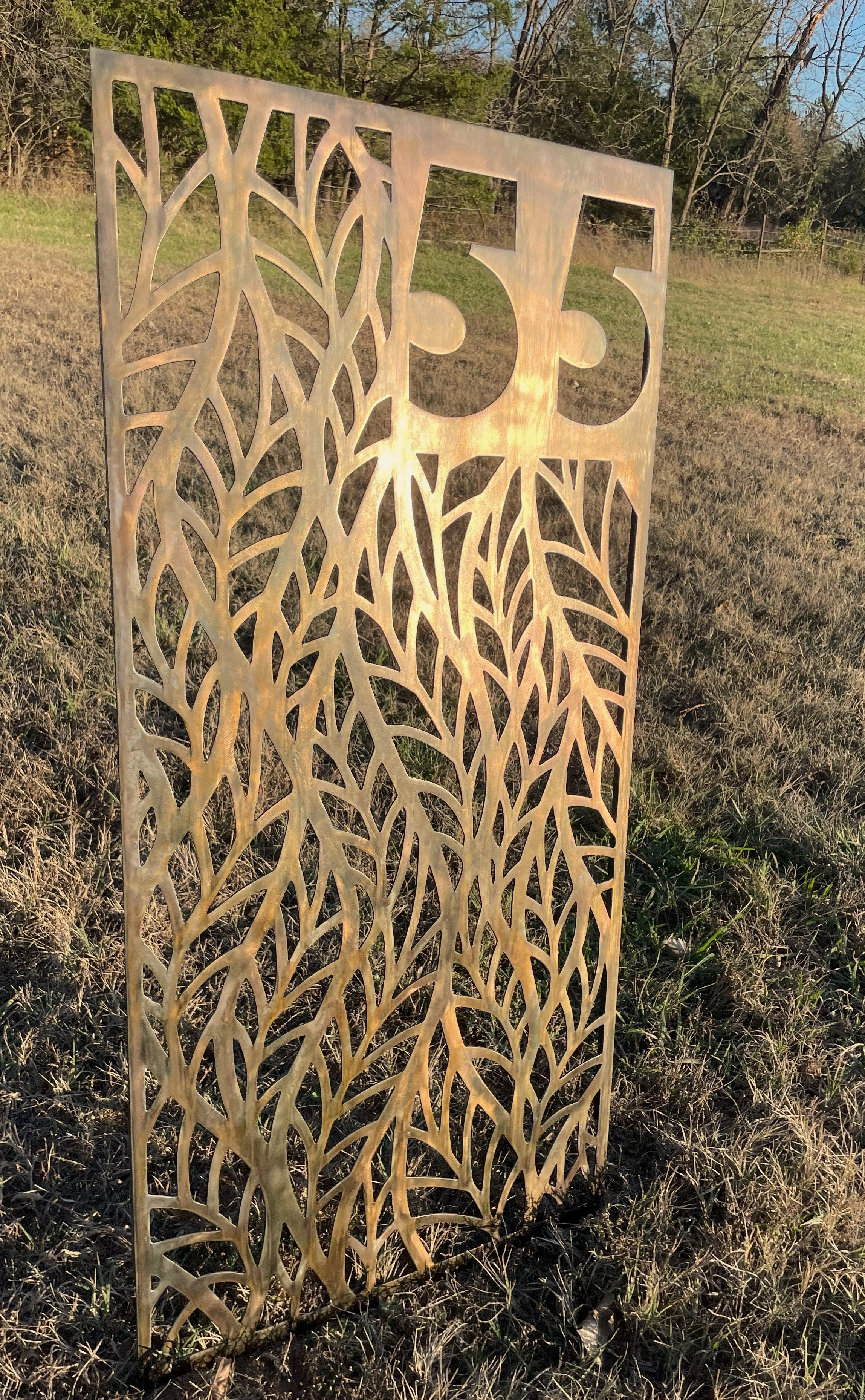 Address sign cut in steel with a copper plate