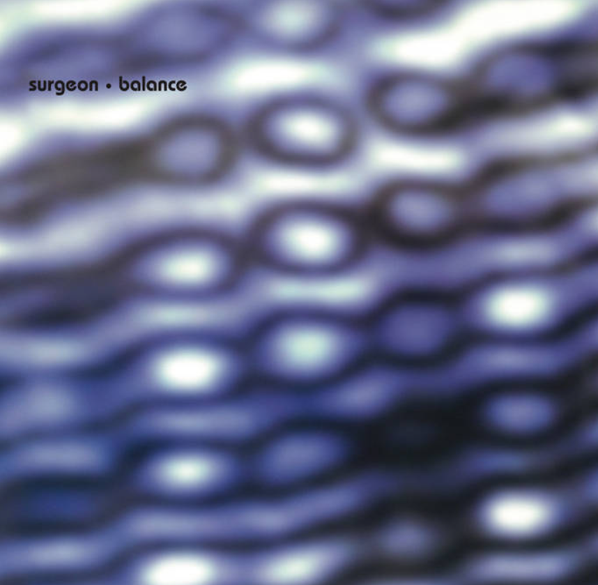 Close-up of a textured surface with wavy patterns and metallic colors, with the words 'surgeon' and 'balance' in the top left corner.
