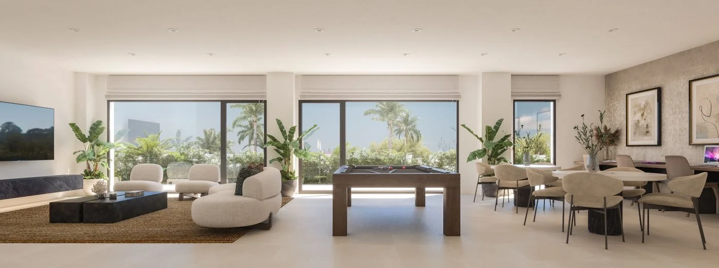 Bright, modern living room with large windows overlooking palm trees, with white seating, black coffee table, pool table, and dining area with beige chairs and artwork on the wall.