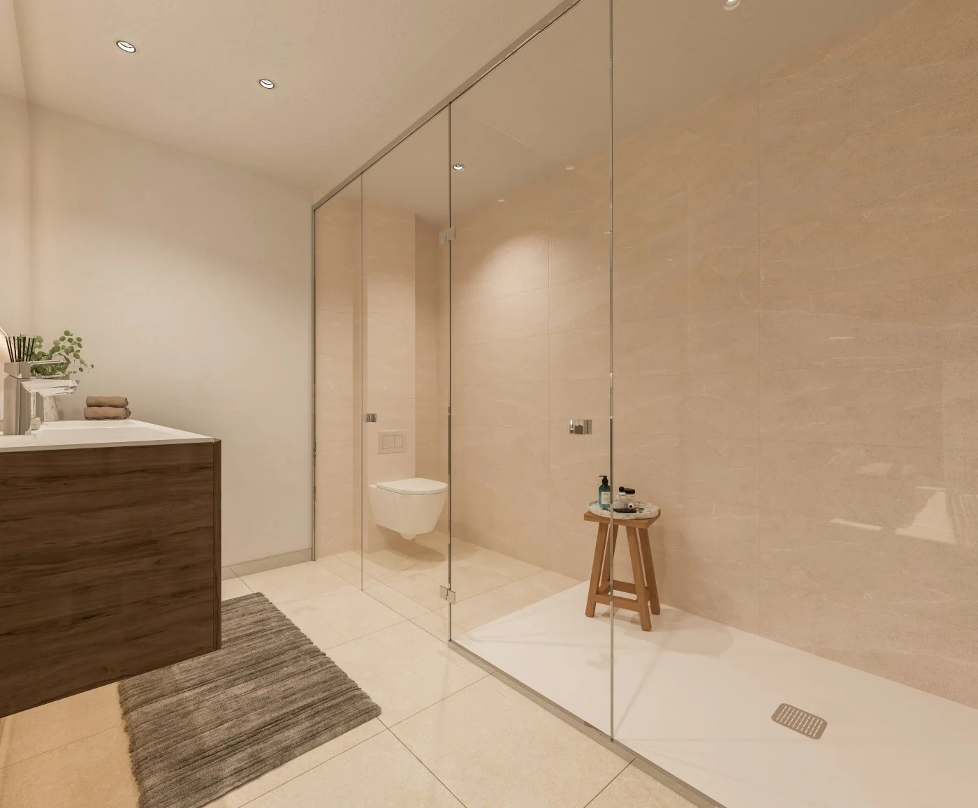 Modern bathroom with beige tiled walls and floor, glass shower enclosure with a small wooden stool holding toiletries, a wall-mounted toilet, a wooden vanity with towels and plants, and a striped gray rug on the floor.