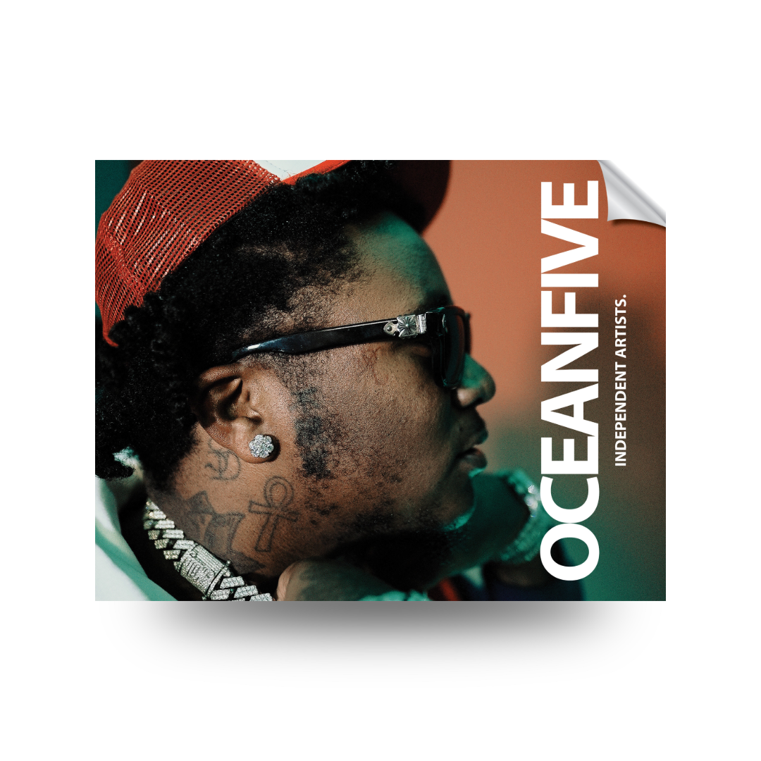 Close-up side profile of a person wearing sunglasses, jewelry, and a red hat, with tattoos visible on the neck, accompanied by text 'OCEANFIVE' and 'INDEPENDENT ARTISTS'.