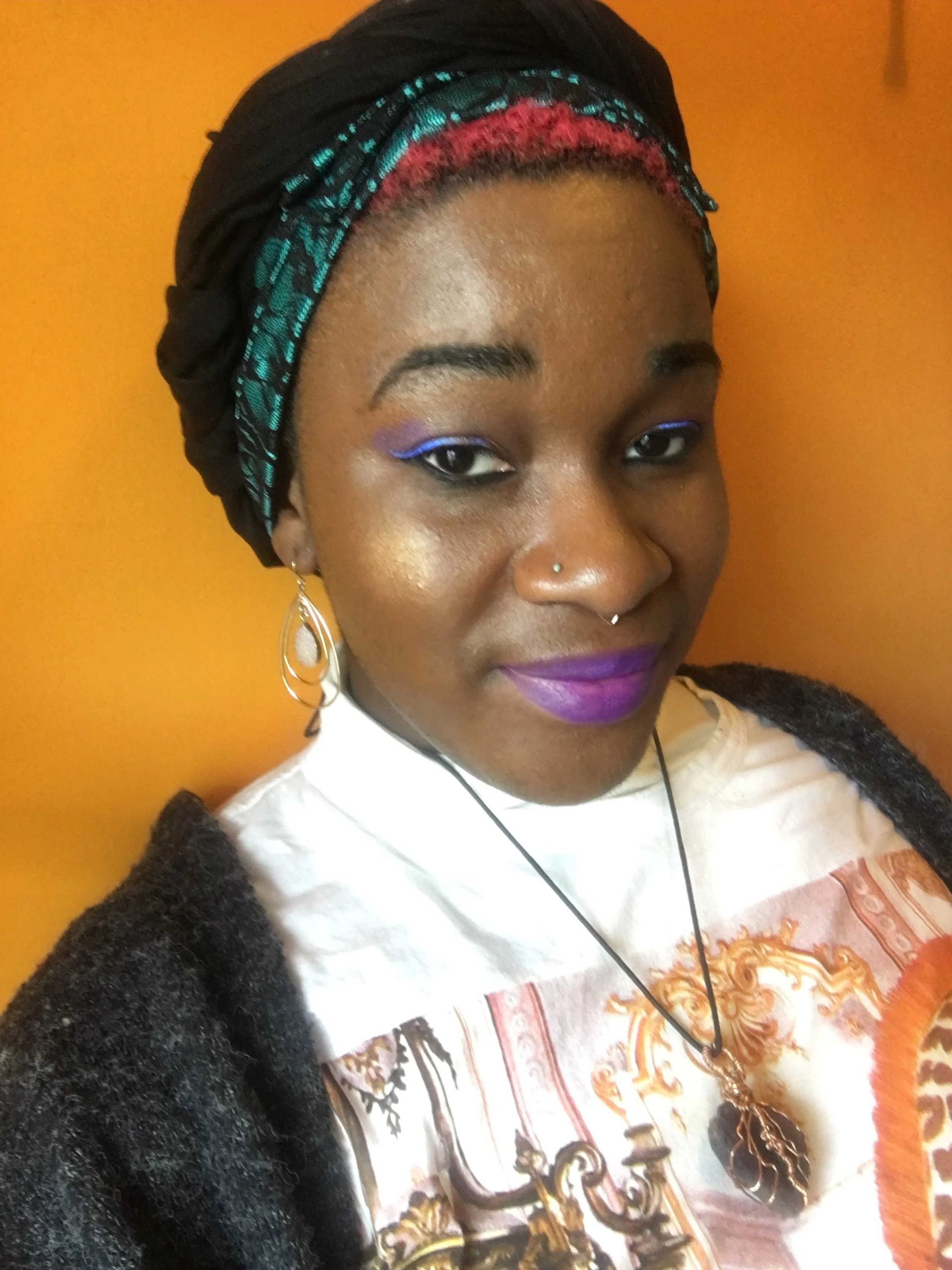 Khadijah La Musa wearing an amethyst pendant.