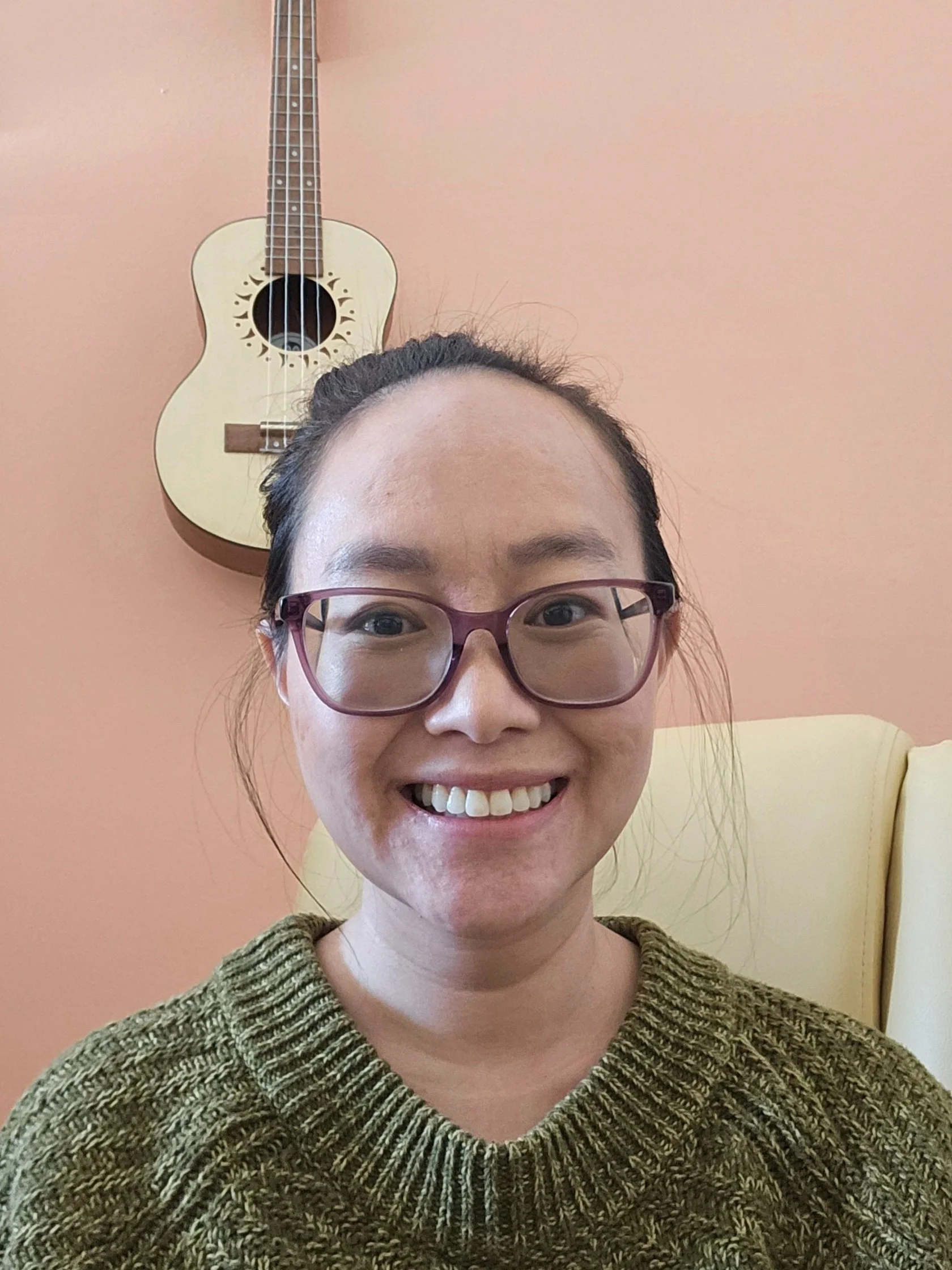 Woman with glasses, pink background
