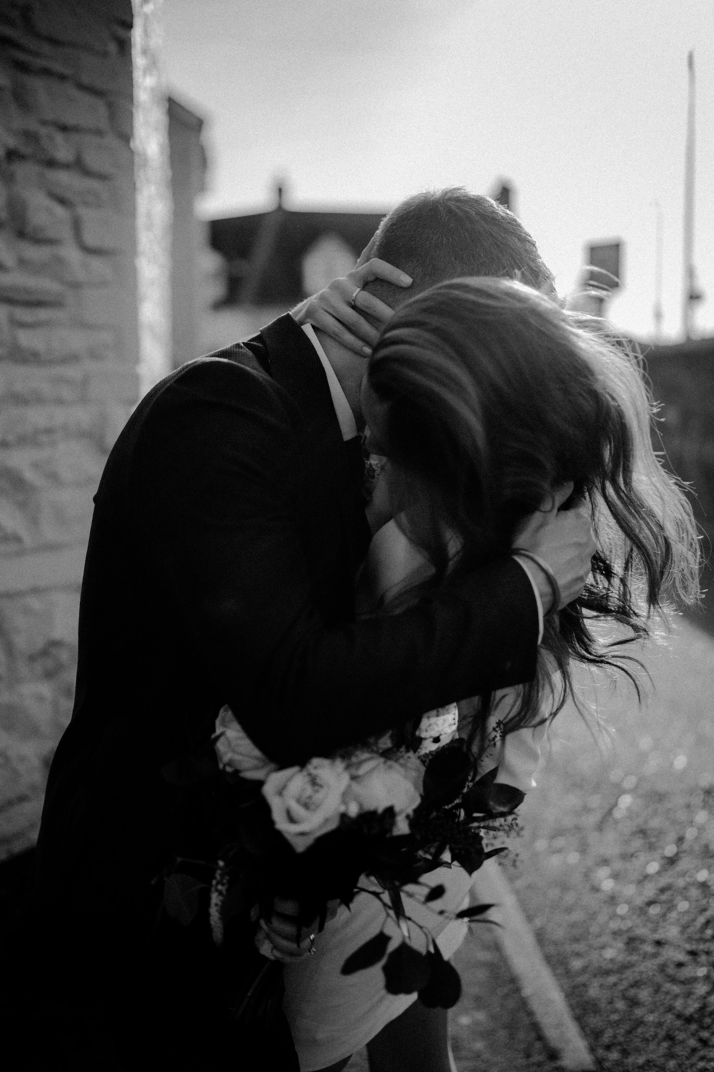 intimate portrait of wedding couple holding each other