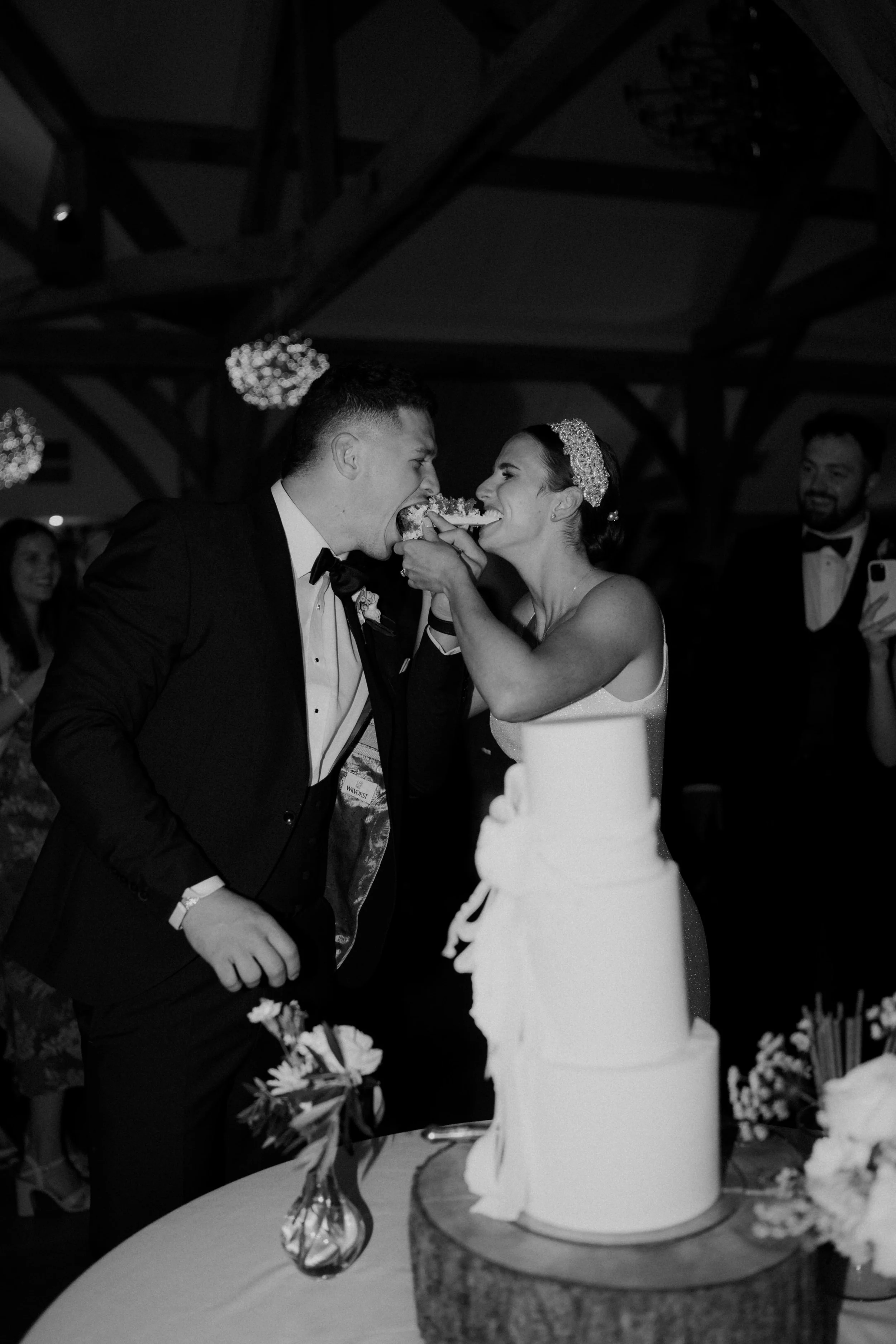 Bride and groom eating wedding cake