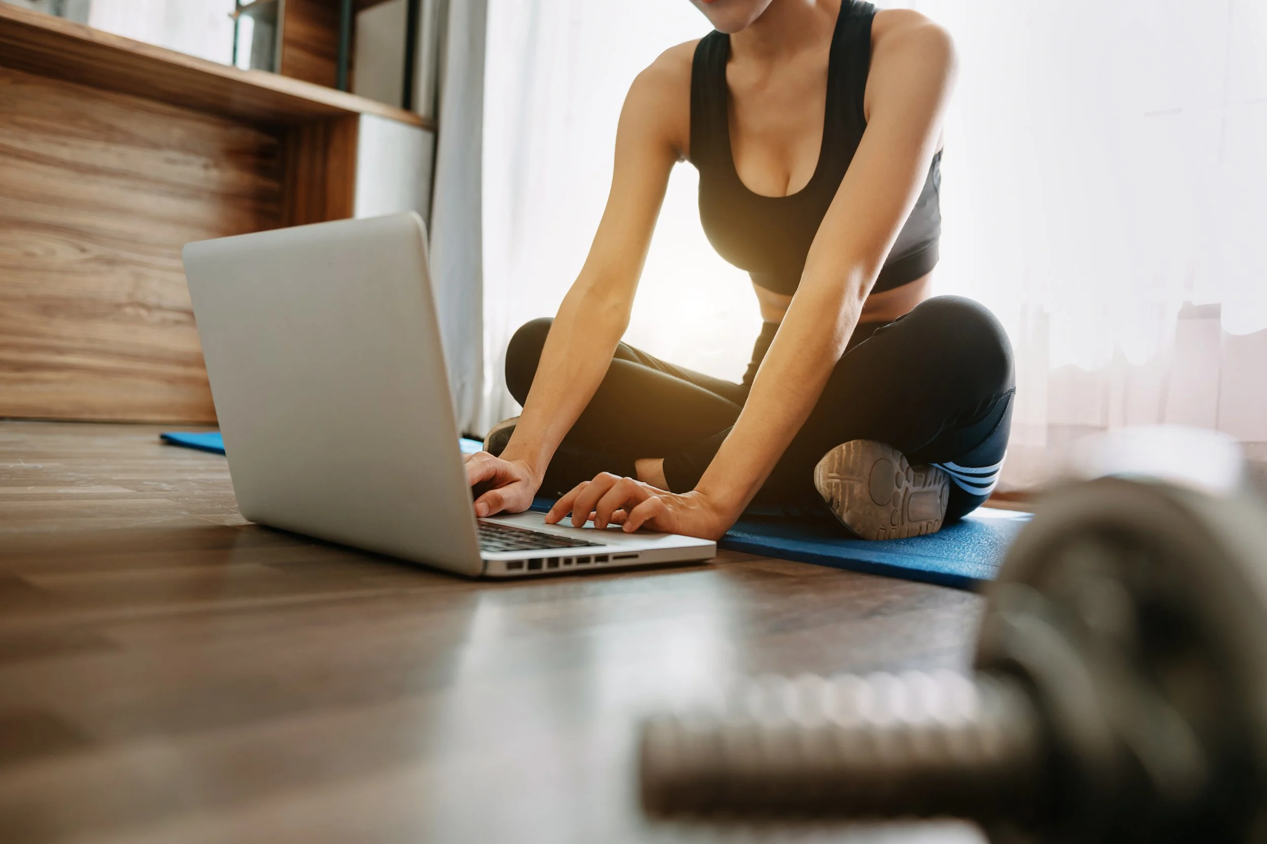 woman-using-laptop-after-workout-at-home-2026-09-22-19-20-43-utc.jpg